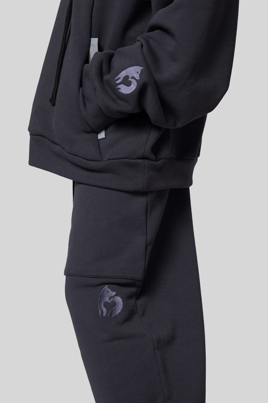 Close-up of side leg on deep grey No Sweat pants and matching Anchor Hoodie