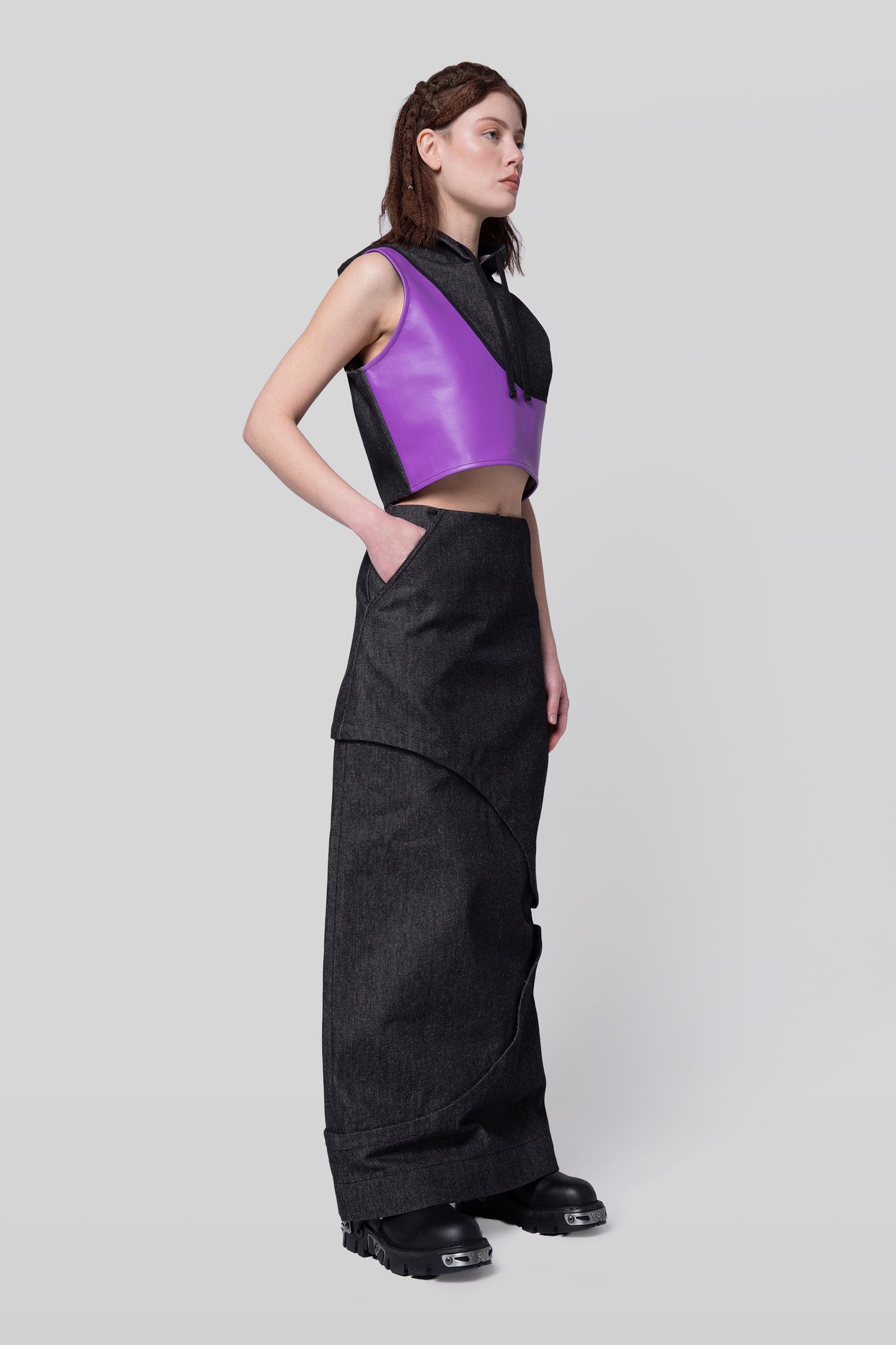 Angled view of 2nd Skin skirt with modular layers in carbon raw denim