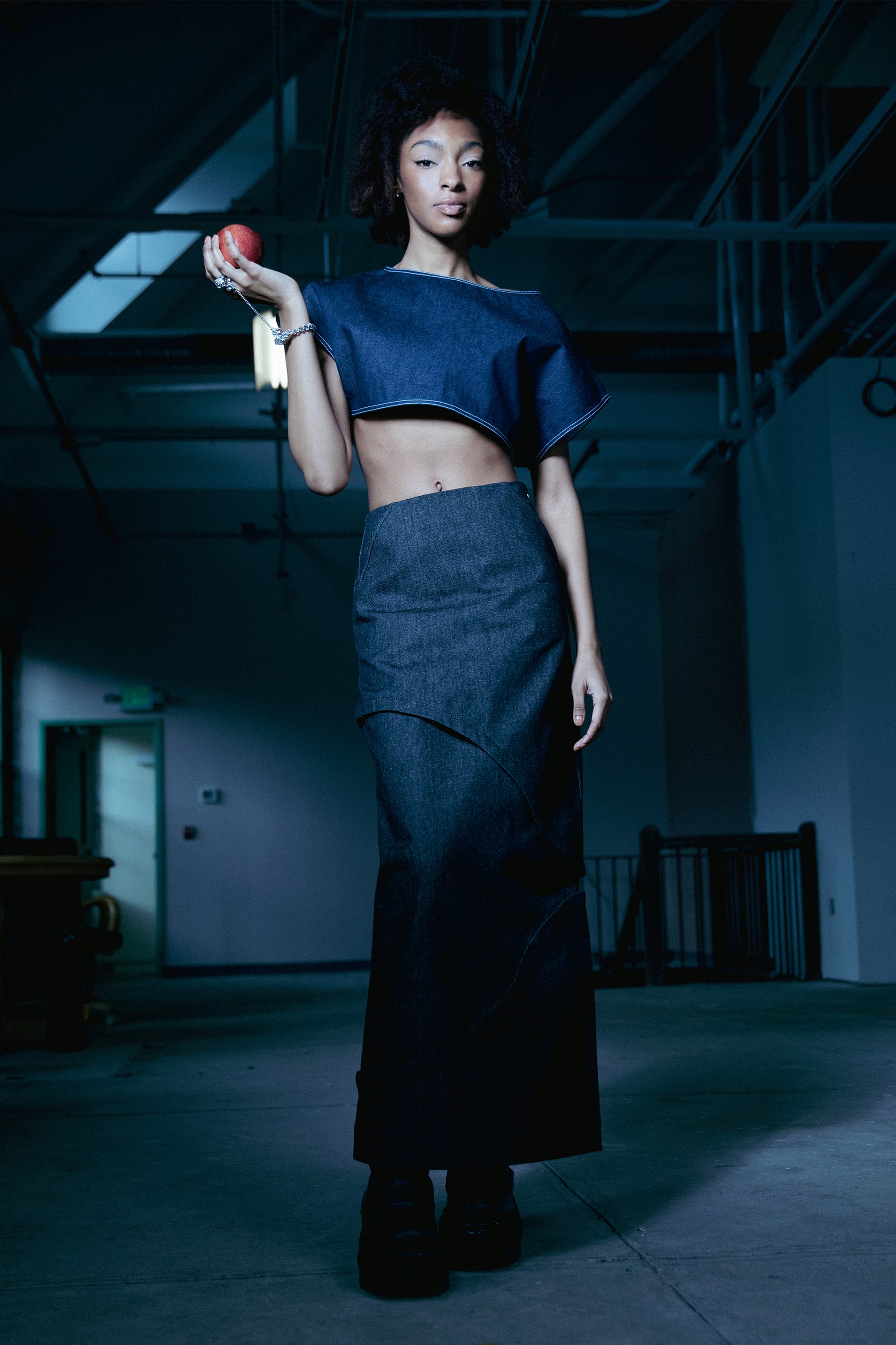 [card:women-primary][card:all-primary] Model wearing 4NML 2nd Skin skirt in carbon Candiani raw denim, modular layered design, and Fly Girl Crop Top