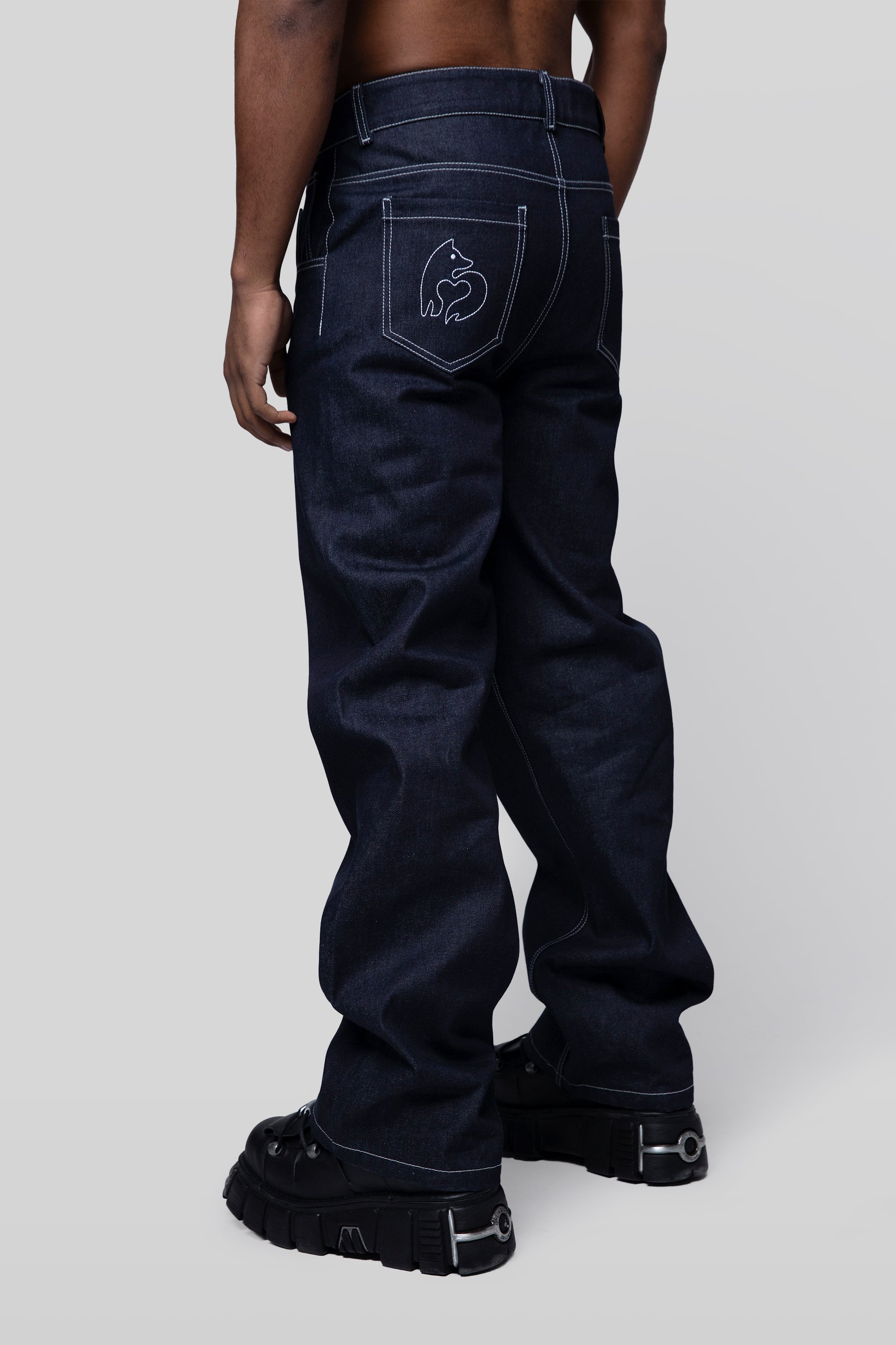 Back angled view of 4Front jeans with fox embroidery on pocket