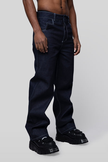 Angled side profile of 4Front jeans in indigo raw denim