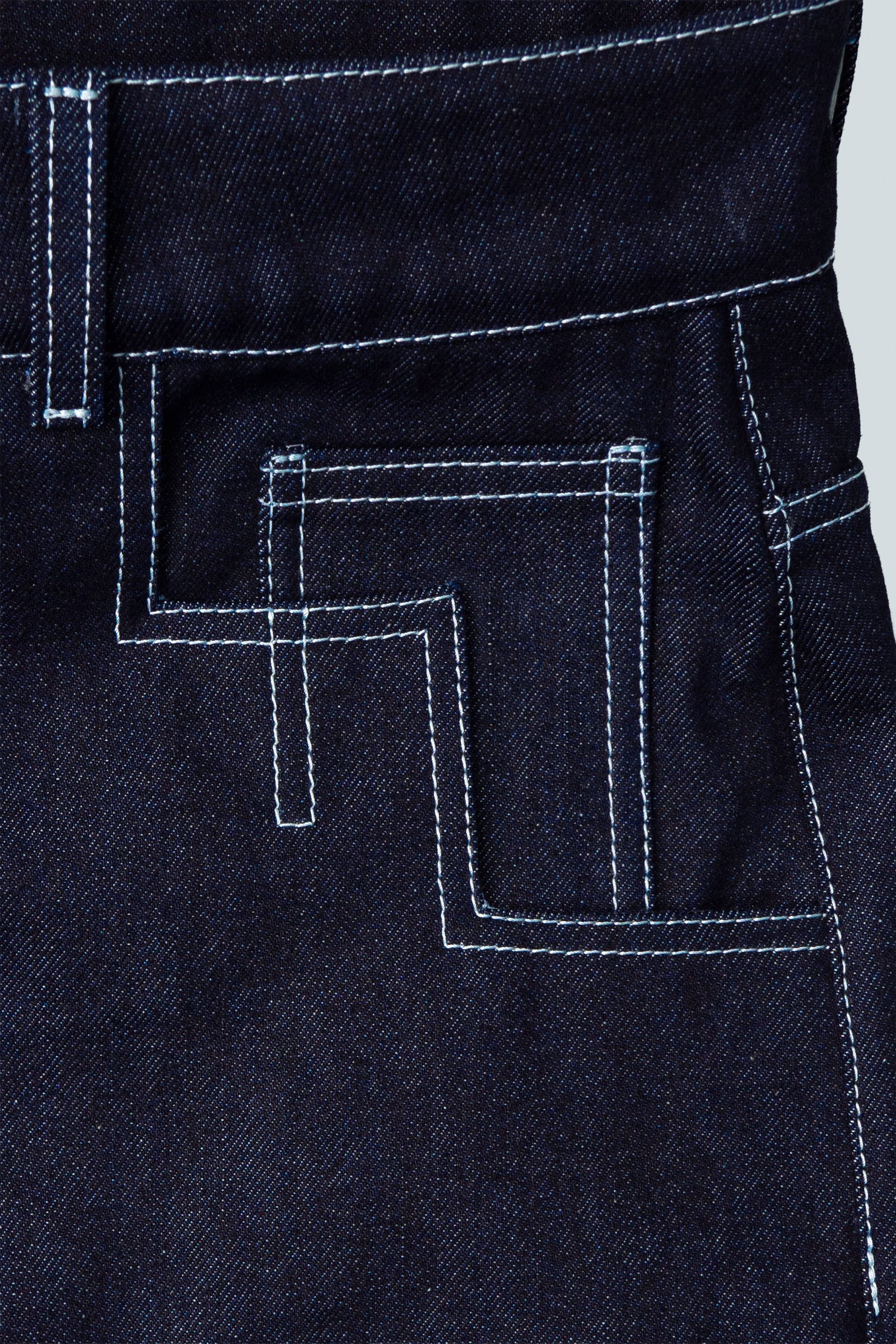 Close-up of stitching detail on indigo Candiani raw denim 4Front jeans