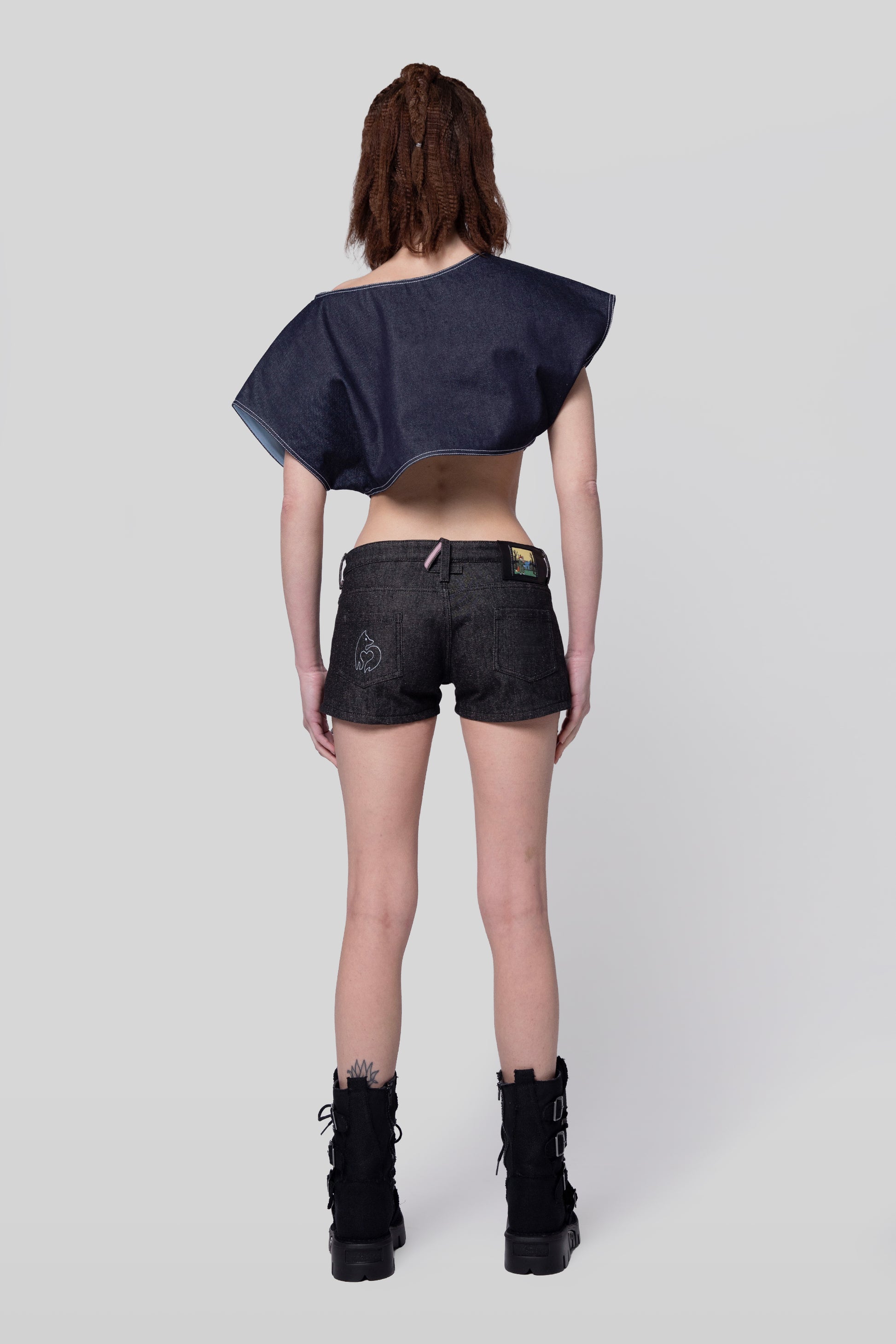 Full body back view of 4Sight shorts with fox embroidery