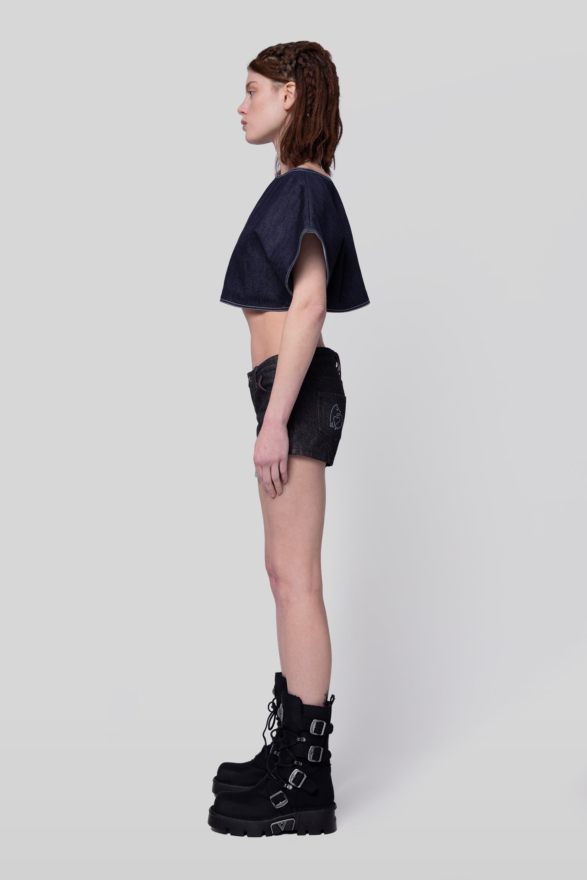 Side profile of 4Sight shorts in carbon raw denim