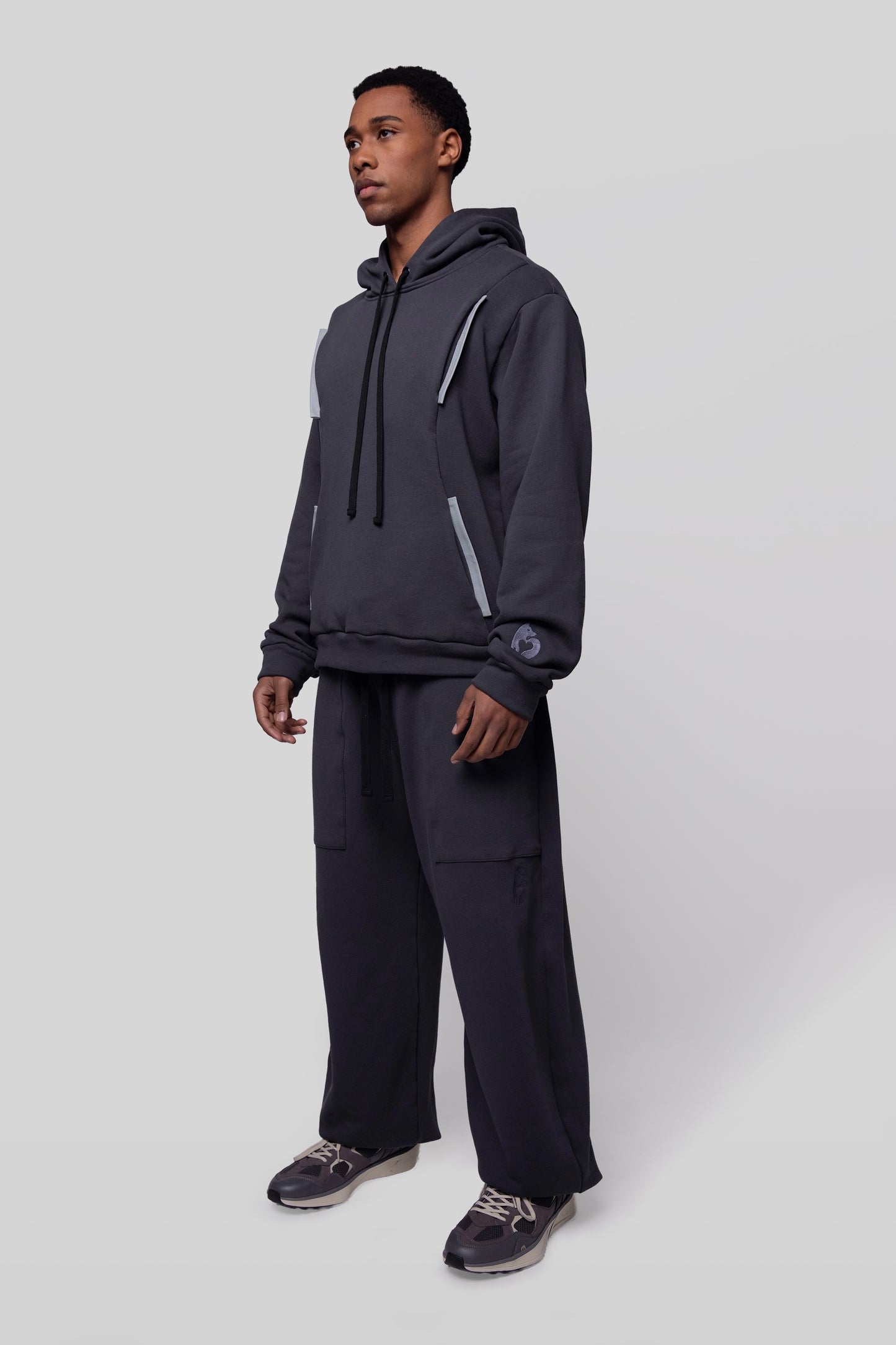 Angled view of Anchor hoodie in deep grey