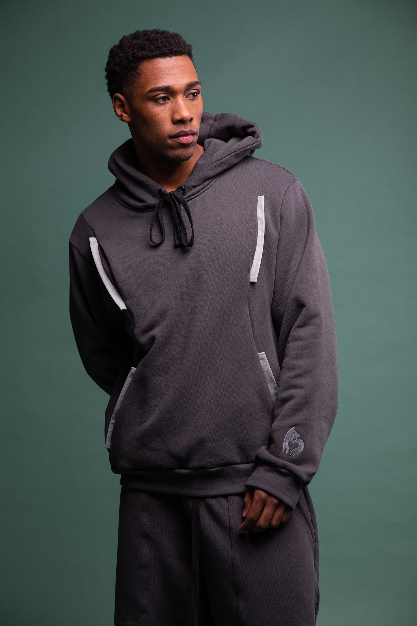 Angled view of Anchor hoodie in deep grey