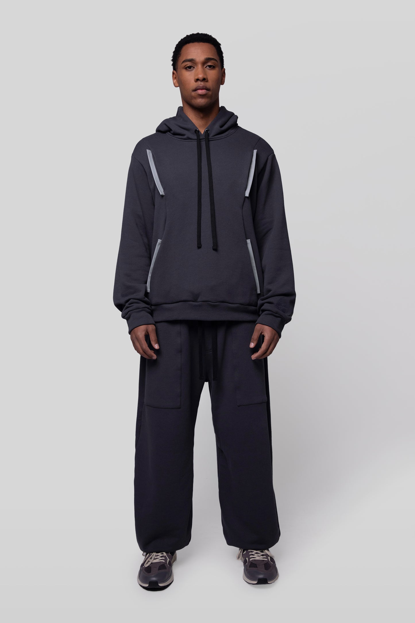 Full body front view of Anchor hoodie in deep grey