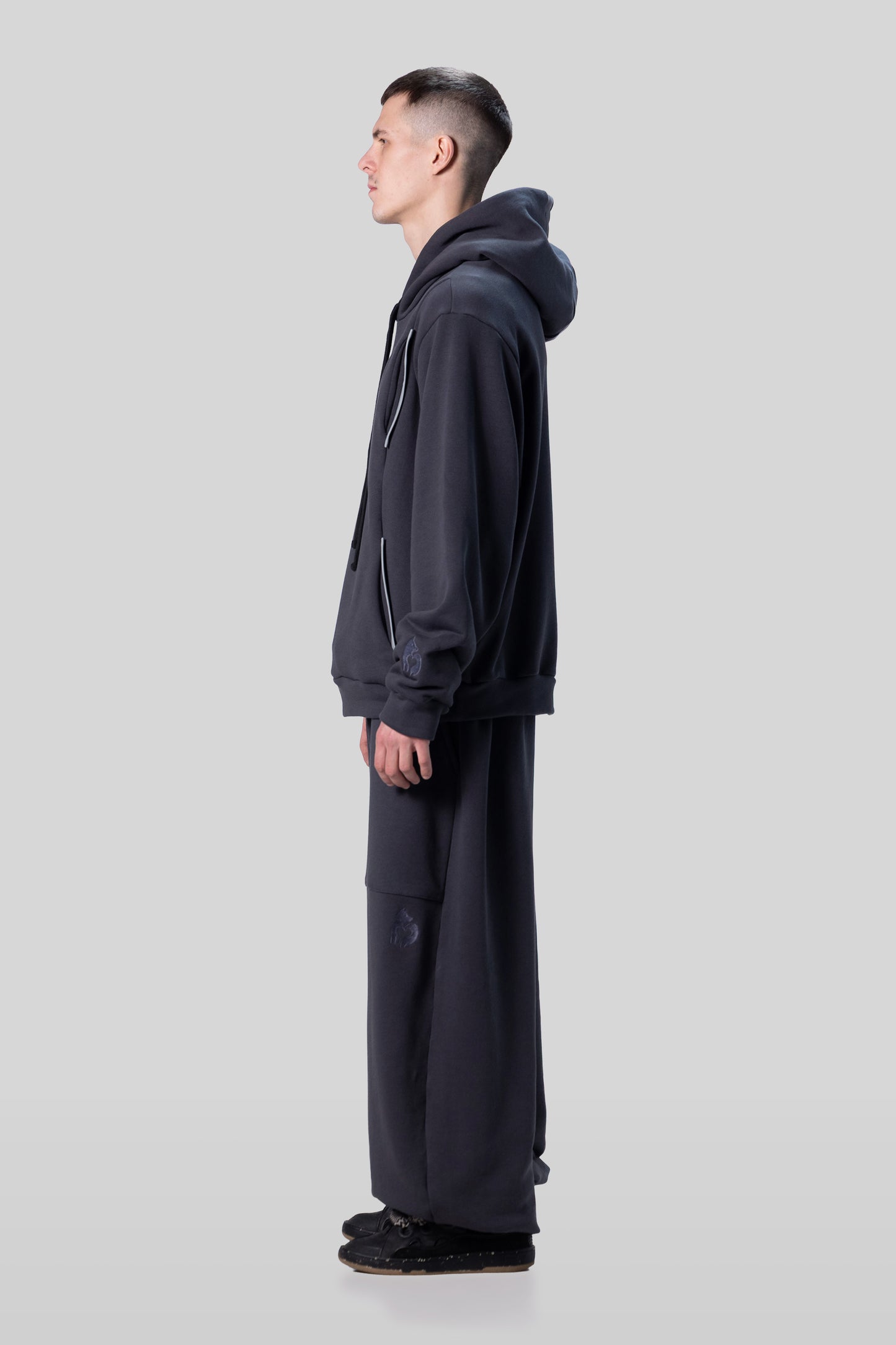 Side view of Anchor hoodie in deep grey