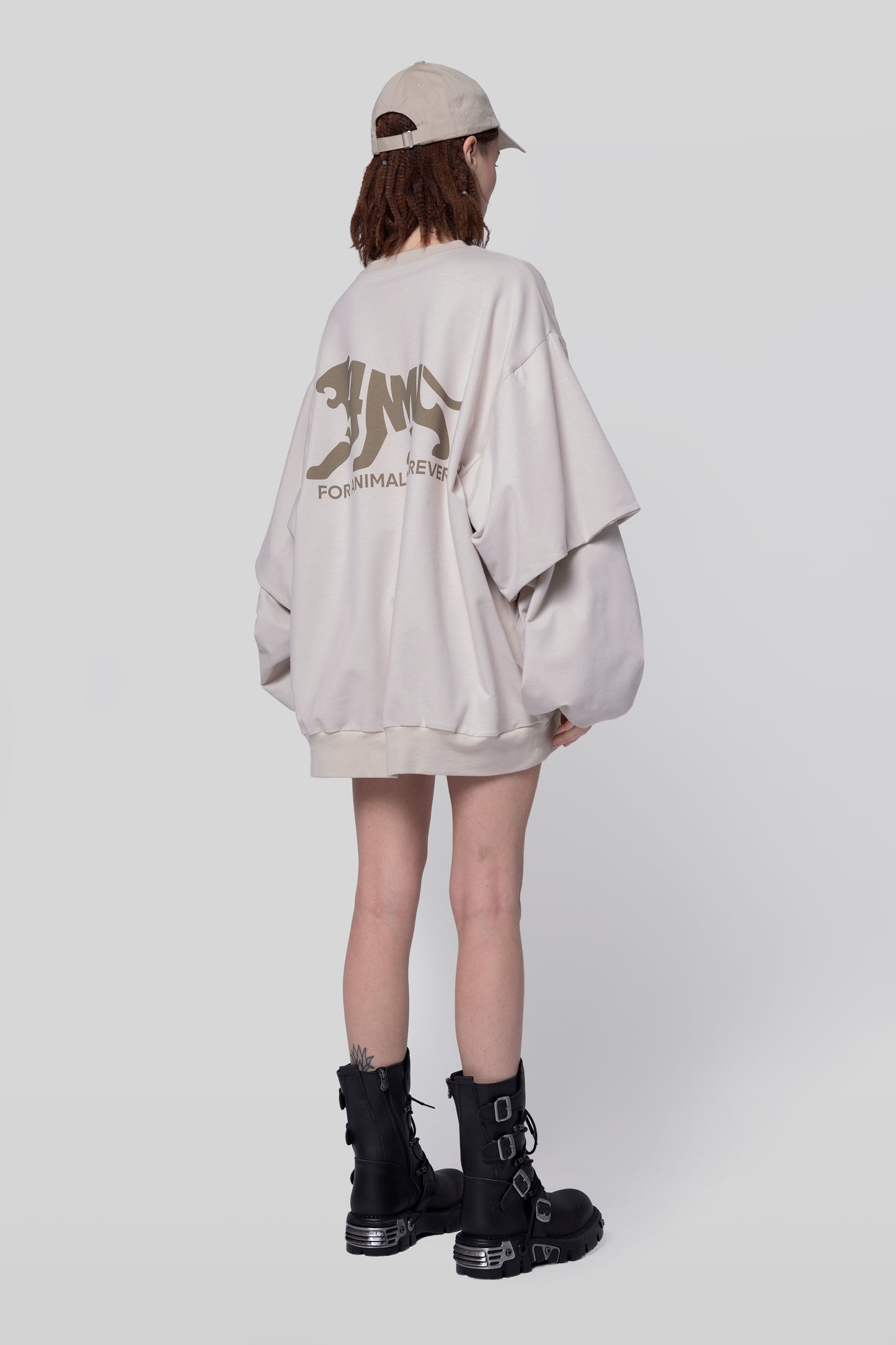 Angled back view of Big Cat Crew sweatshirt in off-white