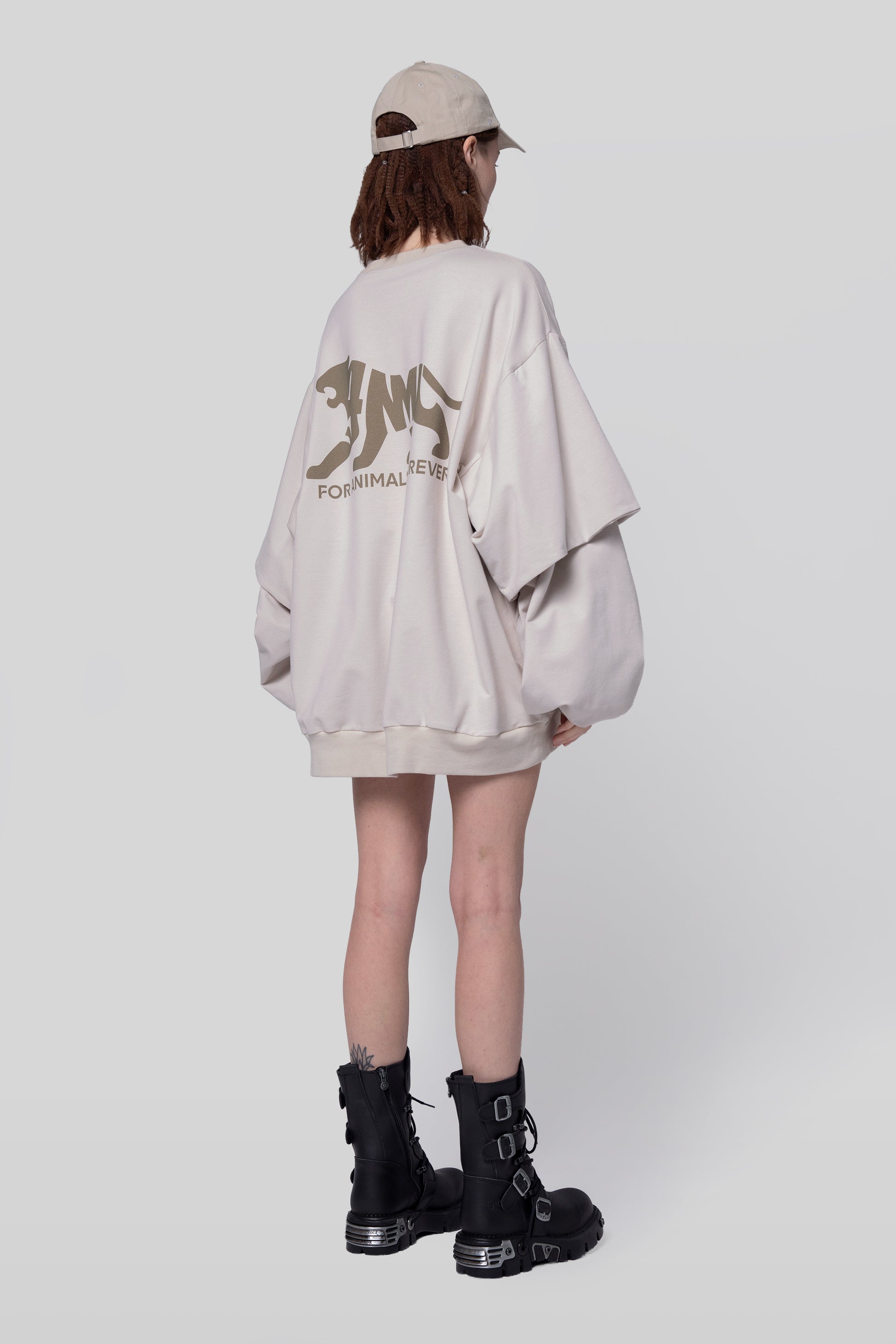 Angled back view of Big Cat Crew sweatshirt in off-white