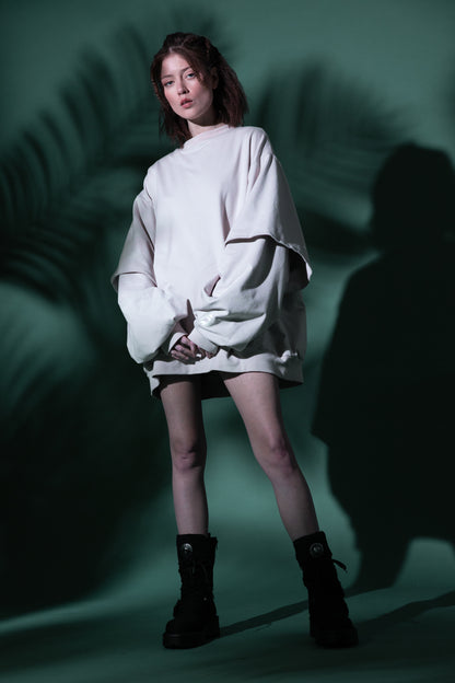 Model wearing Big Cat Crew sweatshirt in off-white with oversized fit