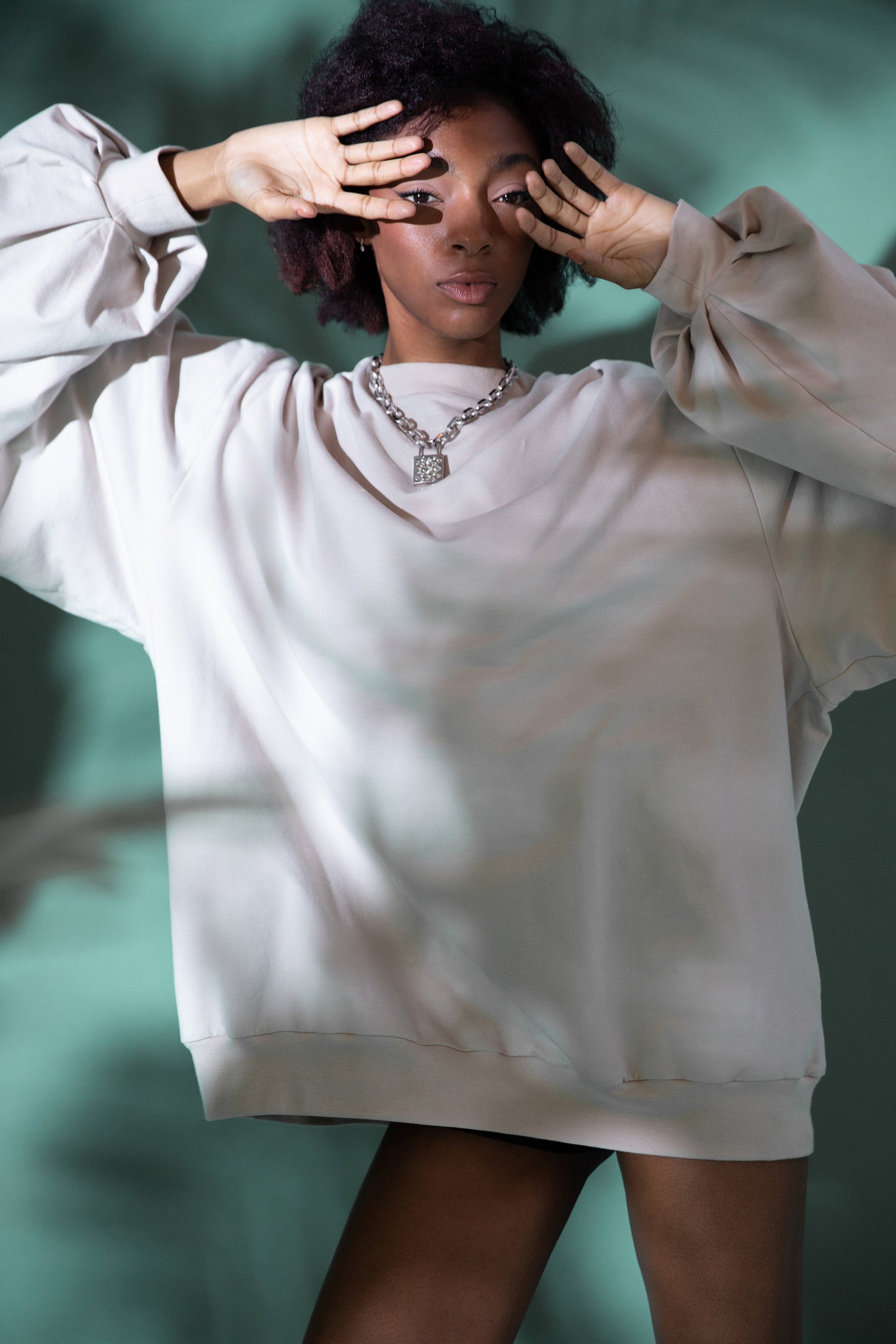 [card:women-secondary] Model wearing Big Cat Crew sweatshirt with oversized sleeves