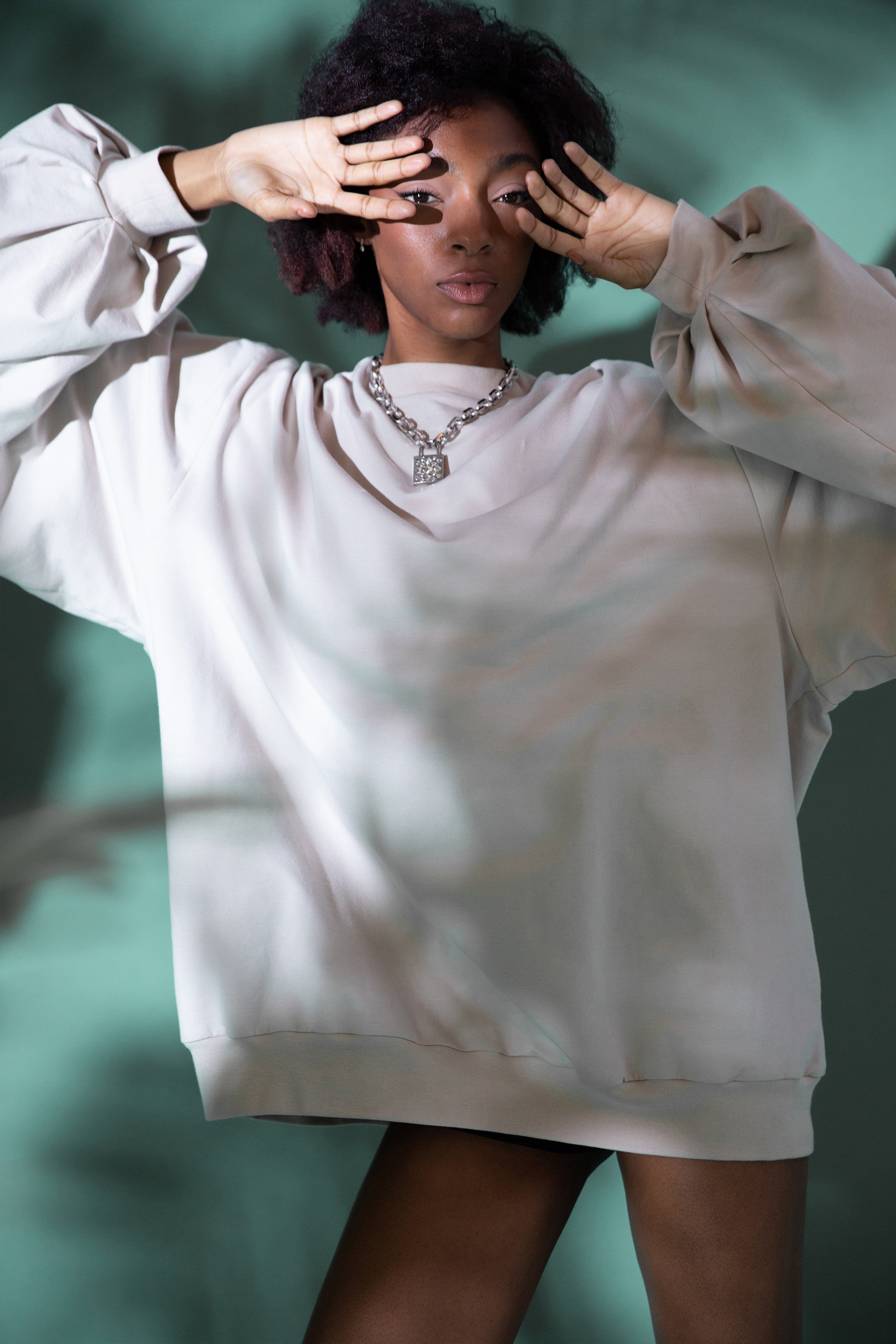 [card:women-secondary] Model wearing Big Cat Crew sweatshirt with oversized sleeves