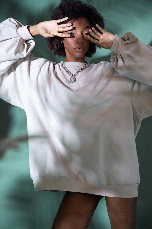 Model wearing Big Cat Crew sweatshirt with oversized sleeves