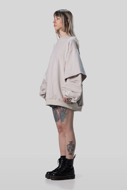 Side view of Big Cat Crew sweatshirt with layered sleeve construction