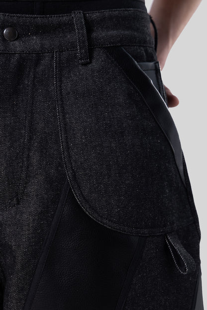 Close-up of black AppleSkin panel and front pocket on carbon Bloom jeans