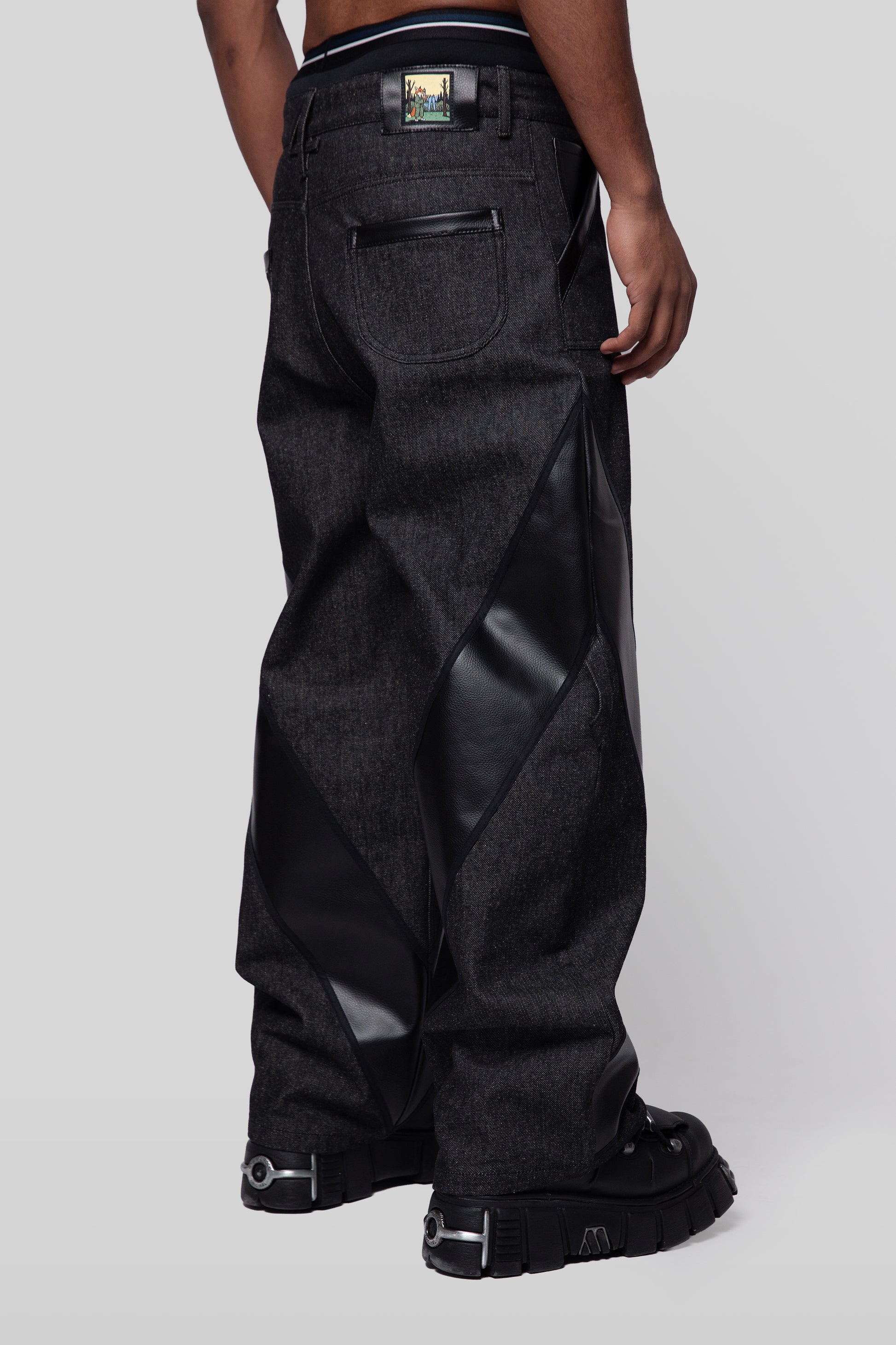 Angled side profile of Bloom jeans in carbon raw denim with AppleSkin panel