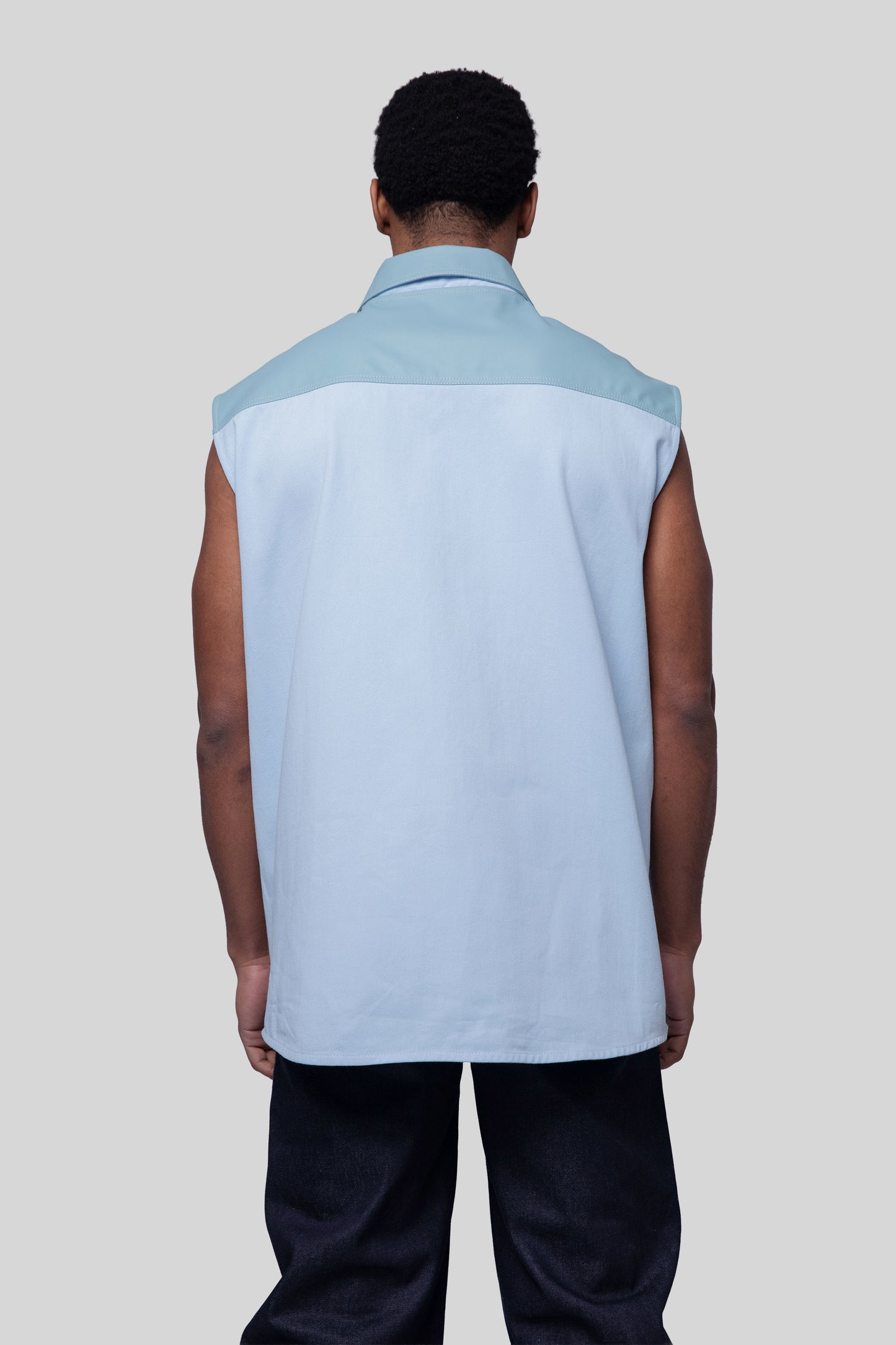 Back view of Blue Collar vest in light blue with structured collar