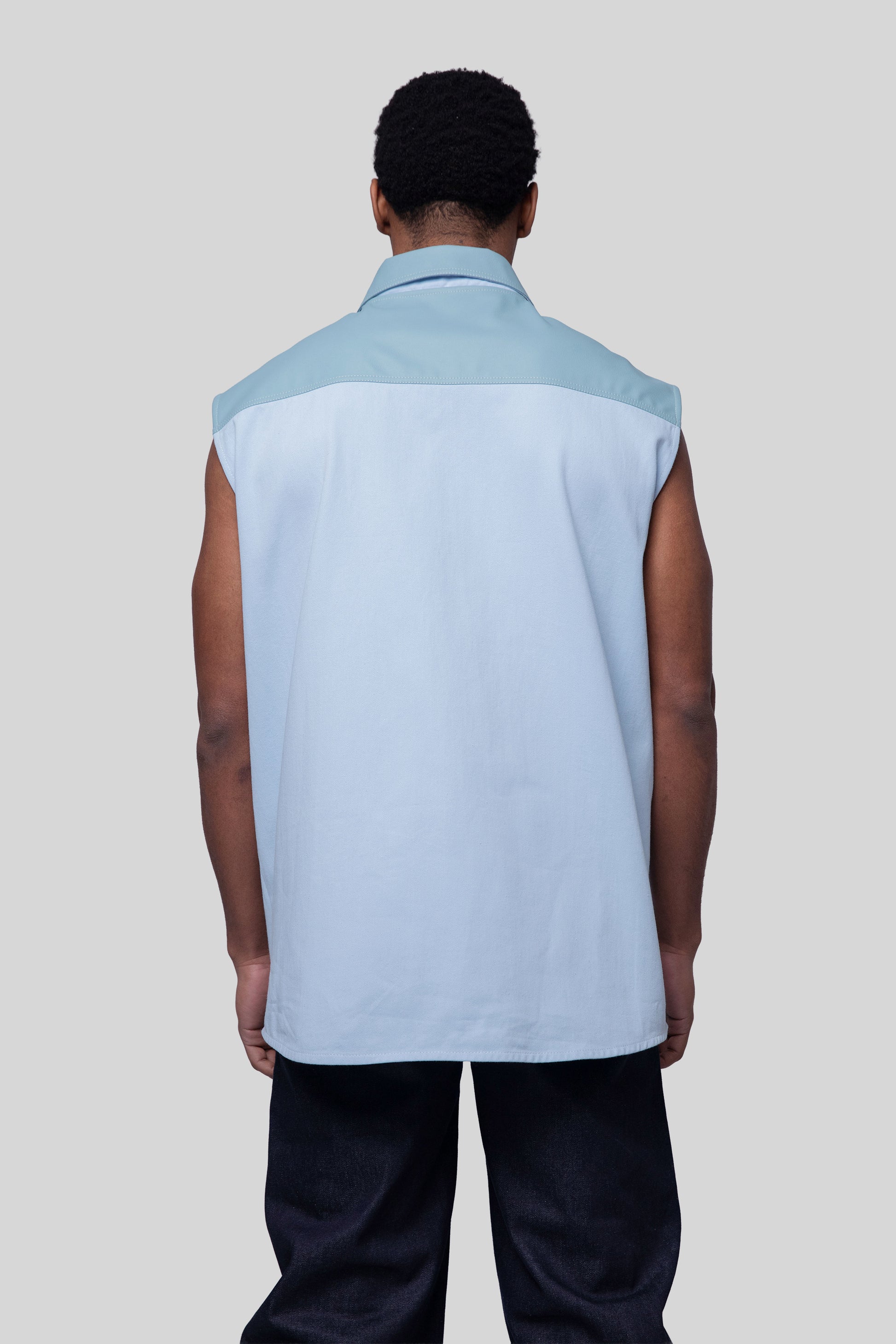 Back view of Blue Collar vest in light blue with structured collar