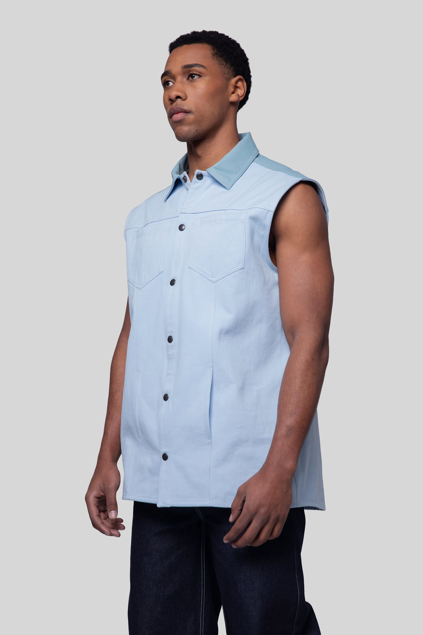 Front angled portrait of Blue Collar vest showing collar and chest pockets
