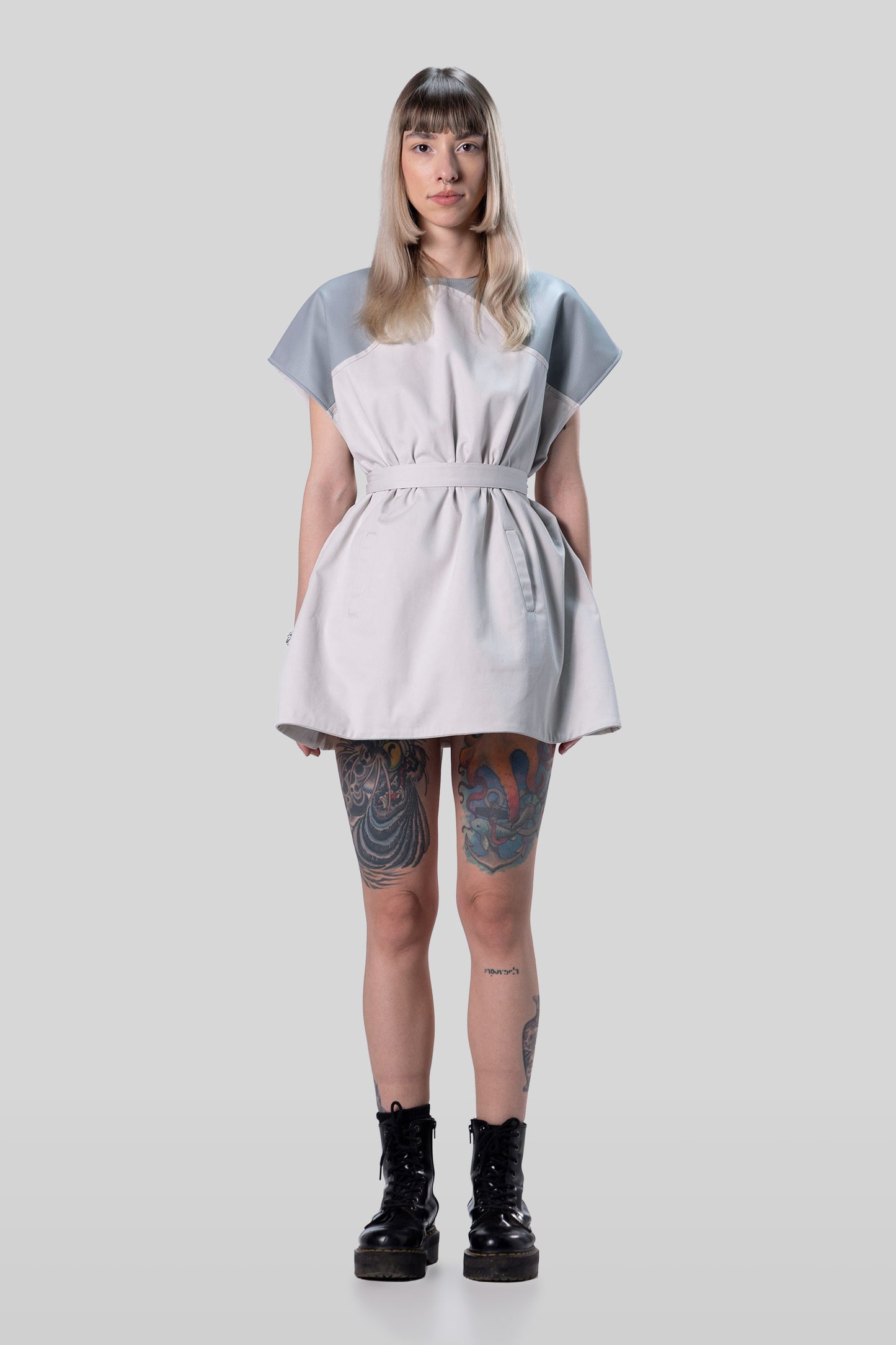 Front view of Chameleon dress in light grey with belt creating fitted silhouette