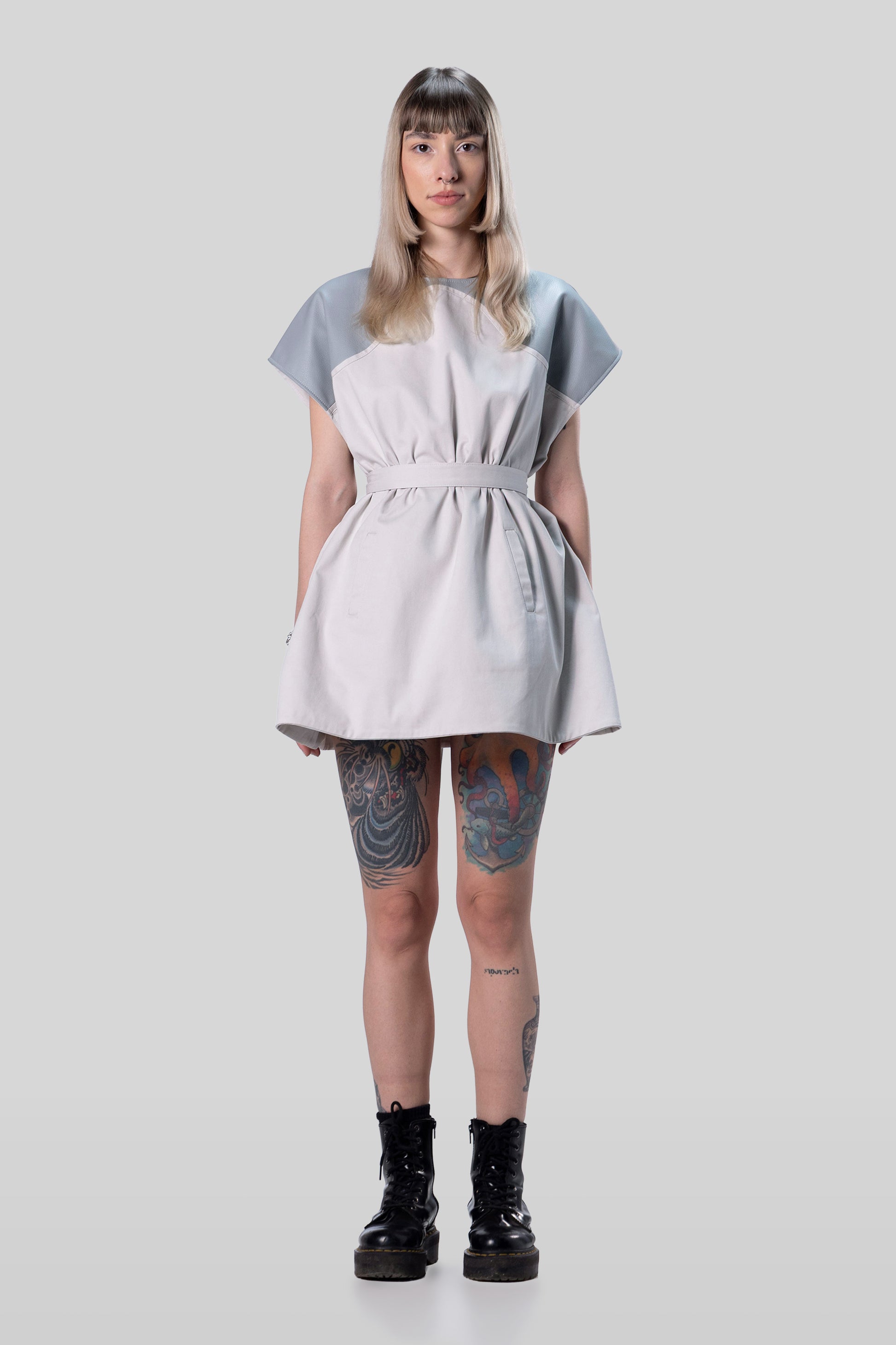 Front view of Chameleon dress in light grey with belt creating fitted silhouette