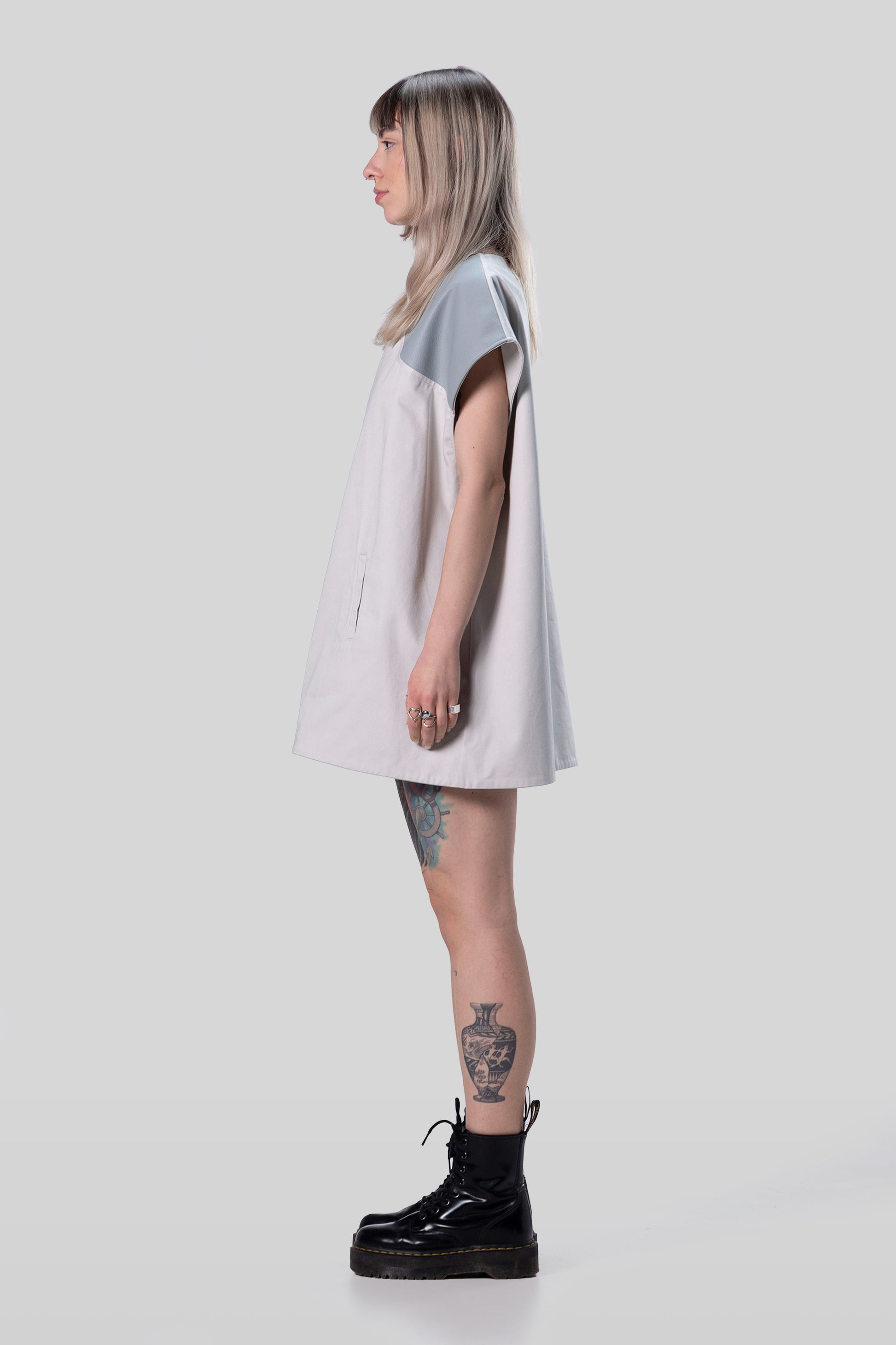 Side profile of Chameleon dress in light grey with relaxed fit
