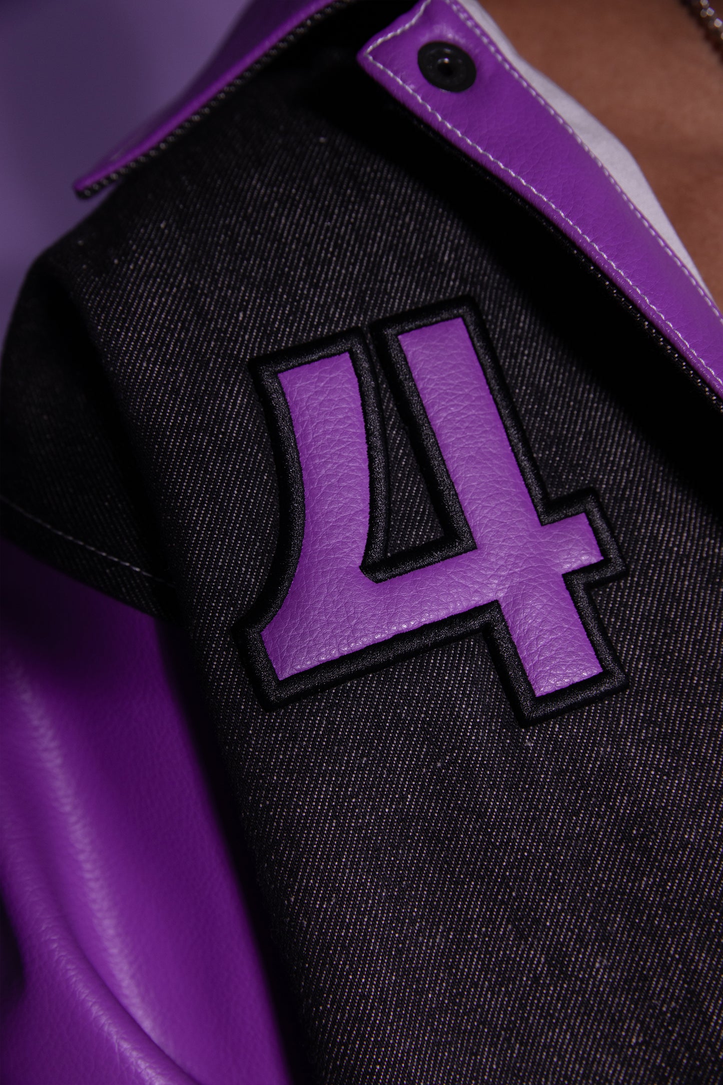 Close-up of number 4 patch on chest of Core jacket