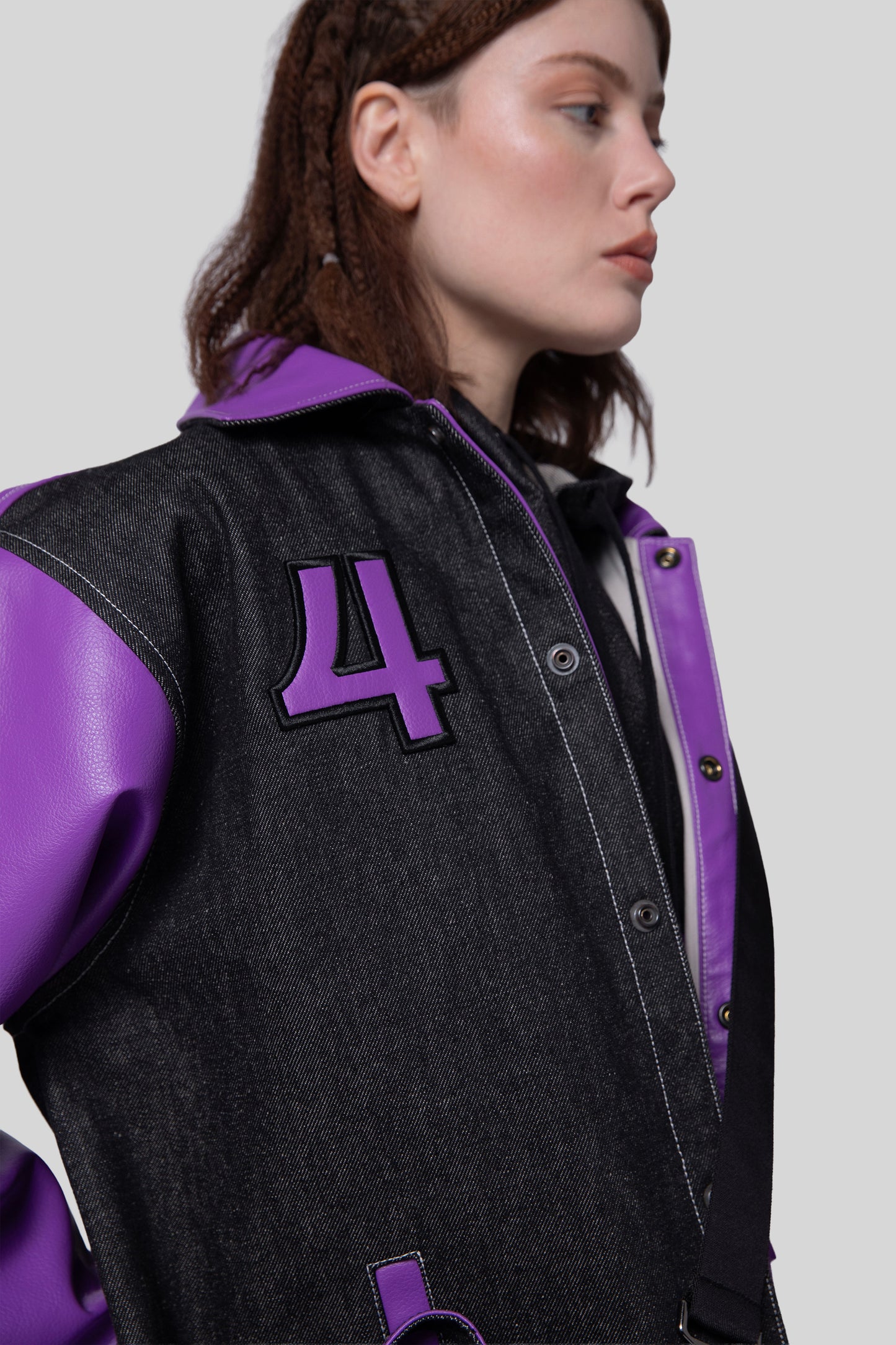 Angled view of Core jacket showing snaps and patch detail
