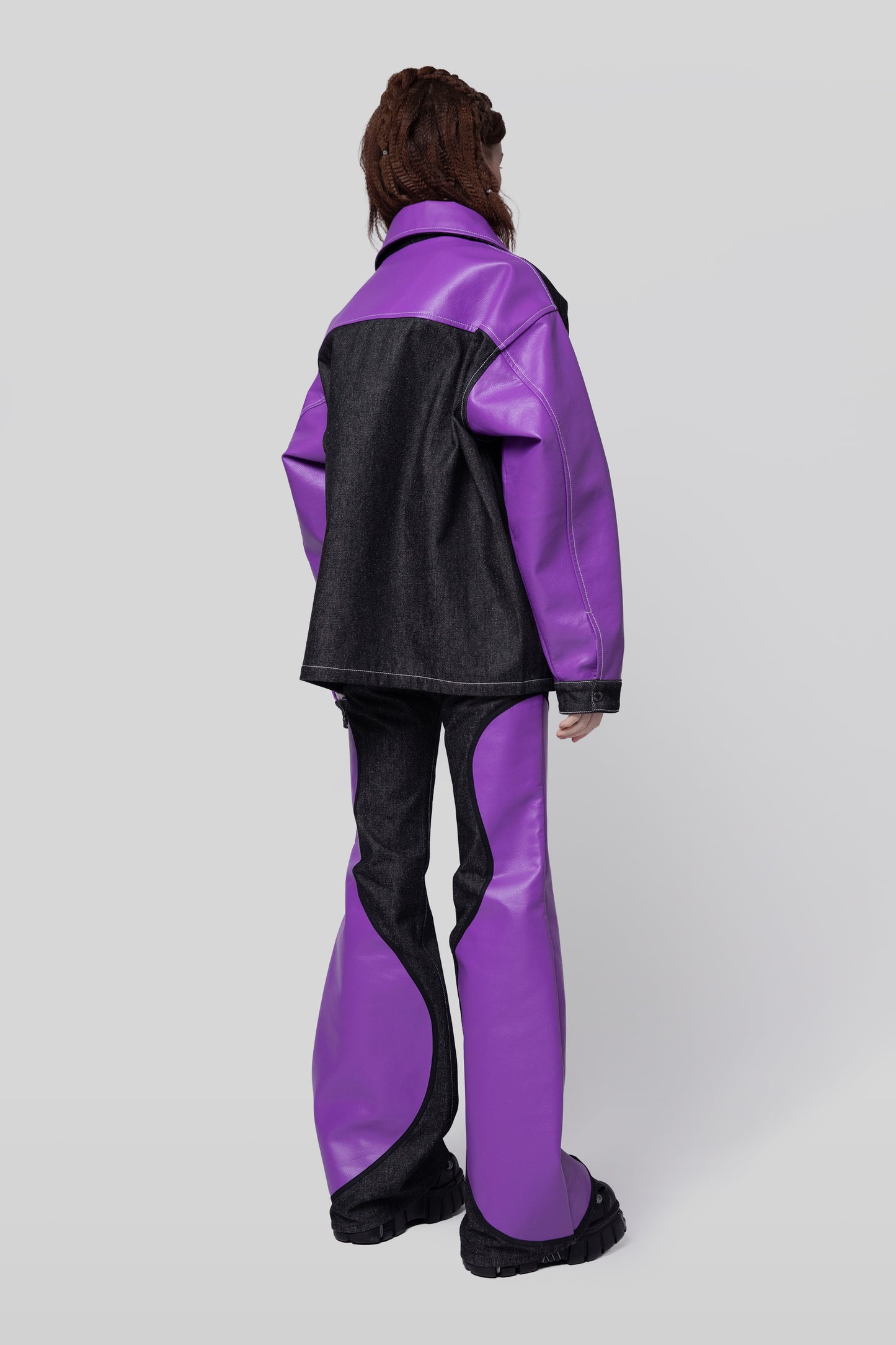Full body angled back view of Core jacket with contrast sleeves