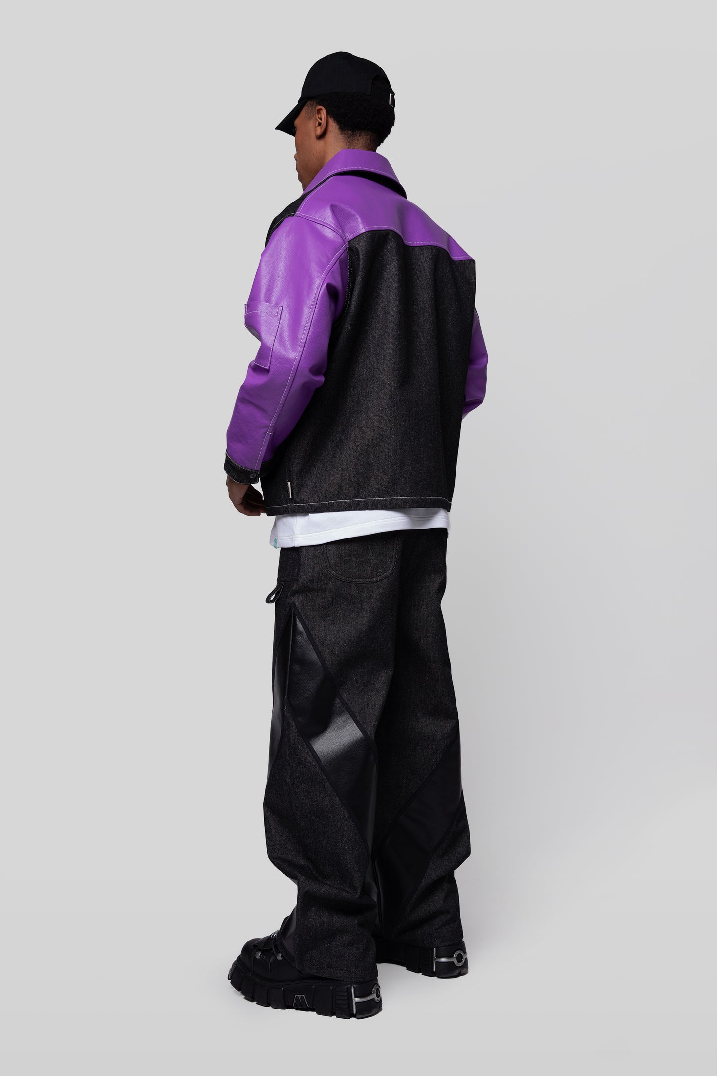 [card:men-secondary] Full body angled back view of Core jacket showing AppleSkin sleeves and panel construction in deep lavender