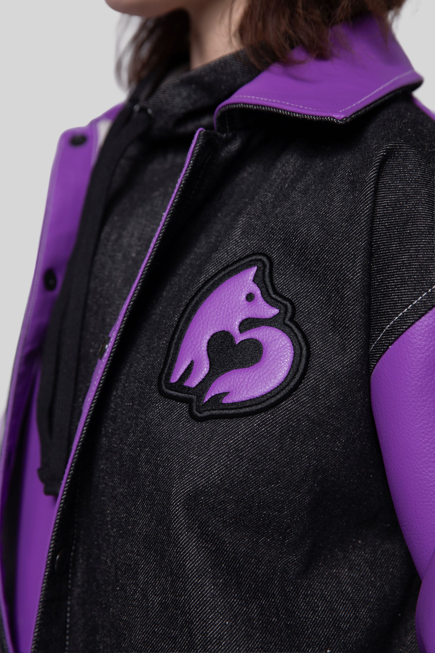 Close-up of collar and fox logo patch on chest of Core jacket
