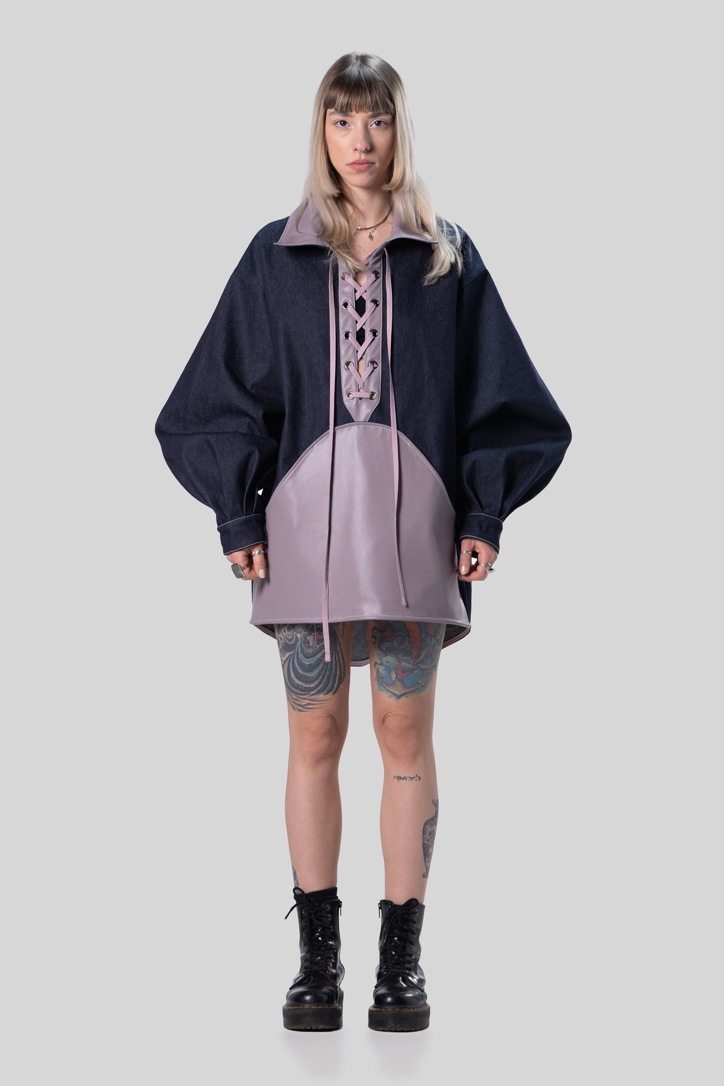 Front view of indigo Candiani raw denim Dovetail Dress with purple AppleSkin panel and lace-up front