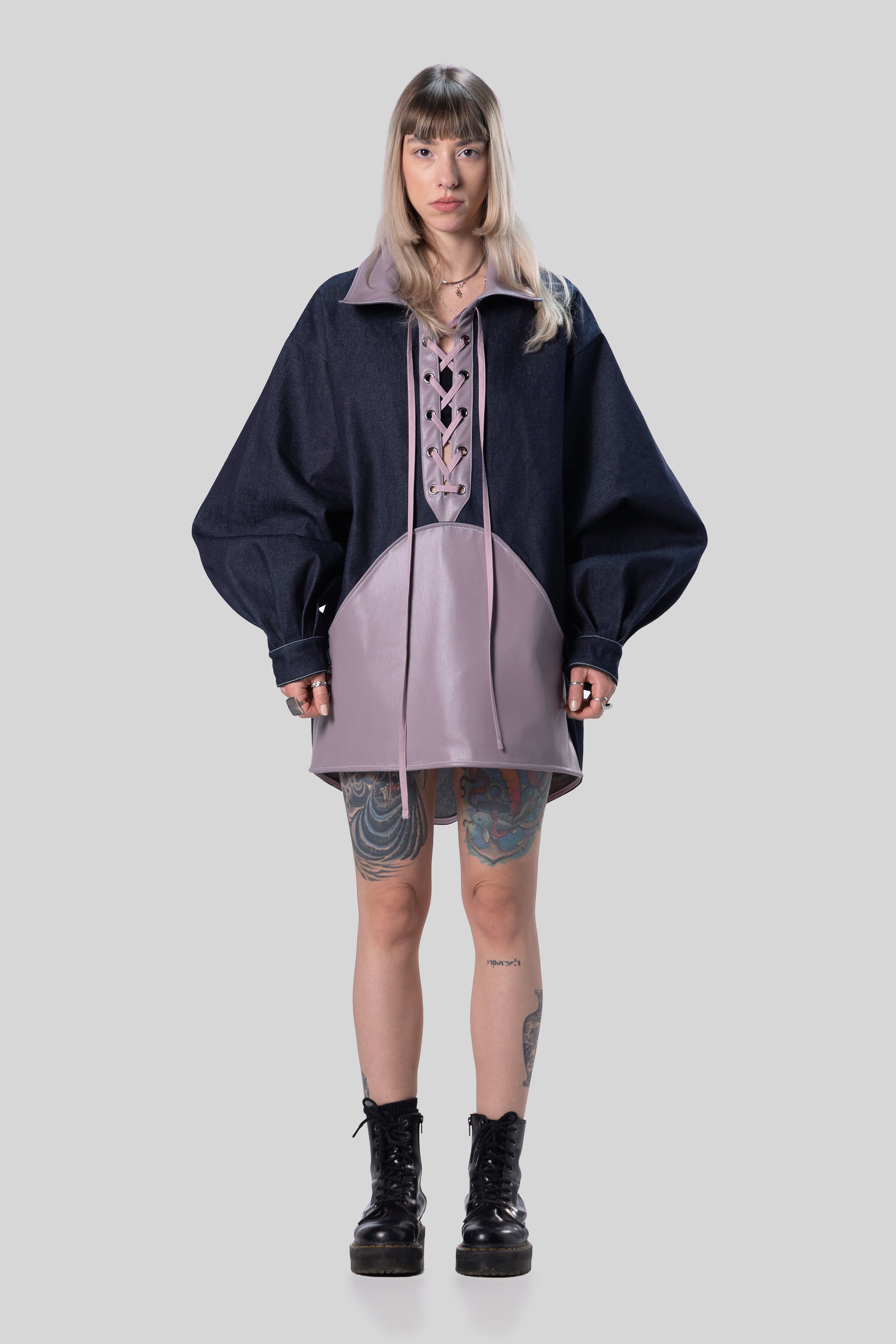 Front view of indigo Candiani raw denim Dovetail Dress with purple AppleSkin panel and lace-up front
