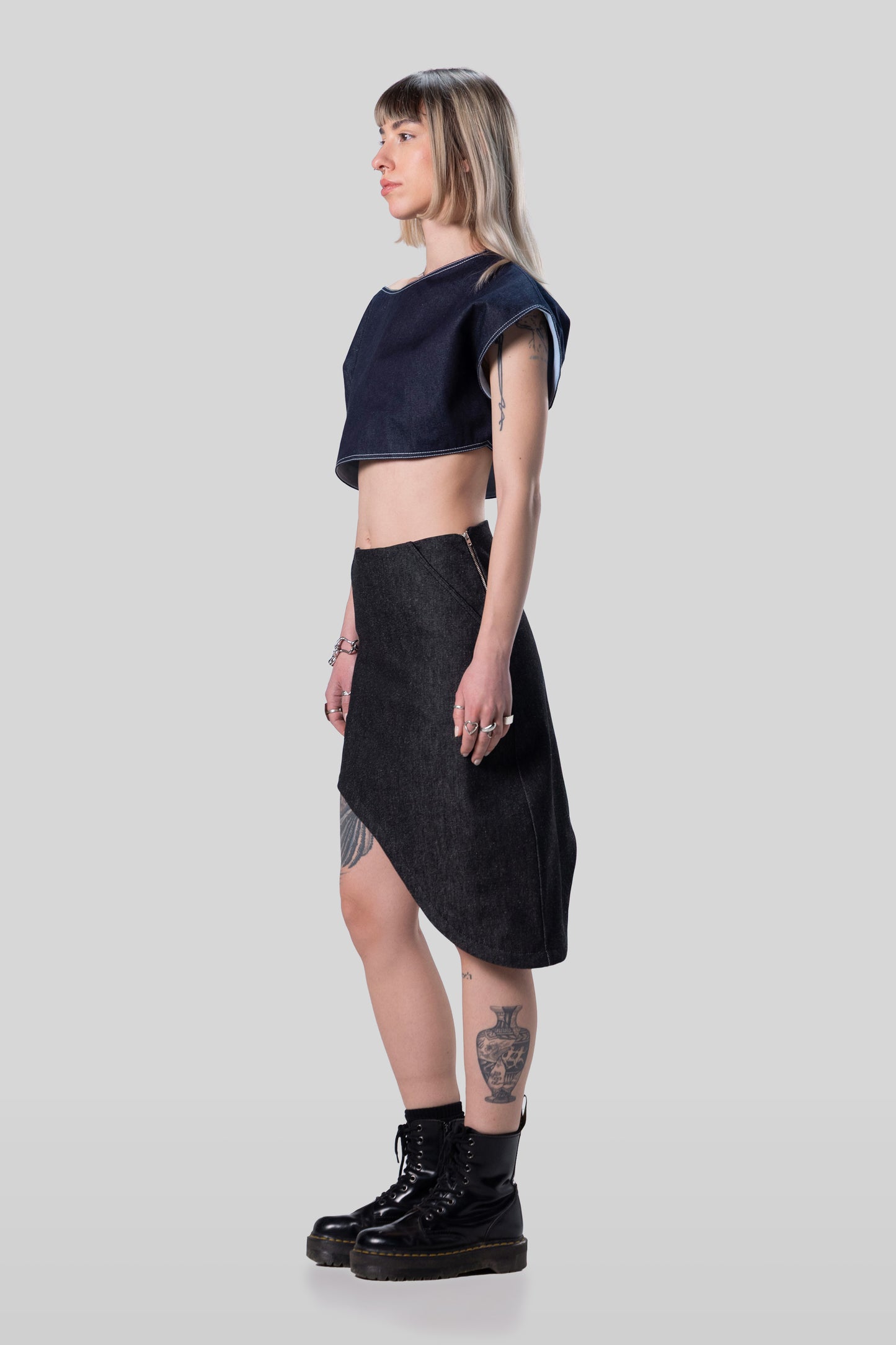 Side profile of Fly Girl crop top with asymmetric off-shoulder silhouette