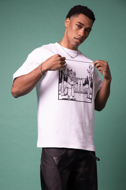 Model adjusting white Supima cotton Lineage Tee with black DTG print, mid shot