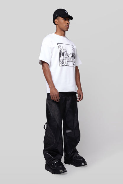 Model in white Supima cotton Lineage Tee with black graphic, angled full body view