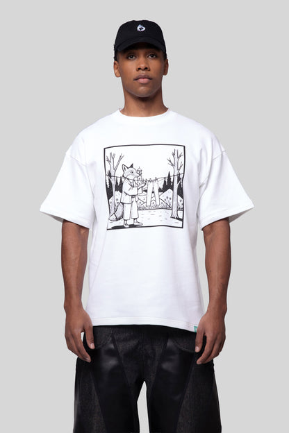 Model wearing white Supima cotton Lineage Tee with black graphic and black cap, front view