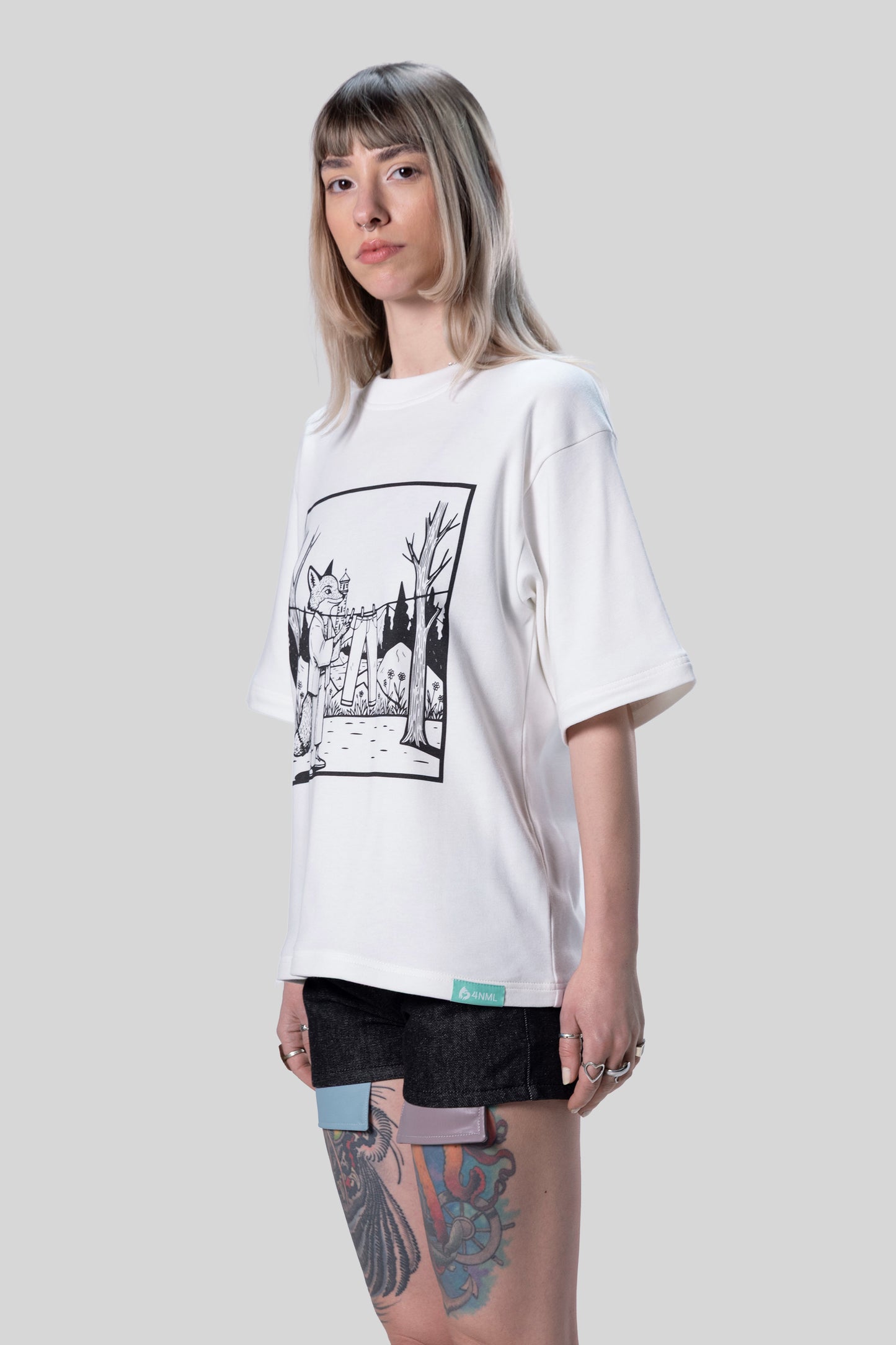 Angled view of white Supima cotton Women’s Lineage Tee with black DTG graphic