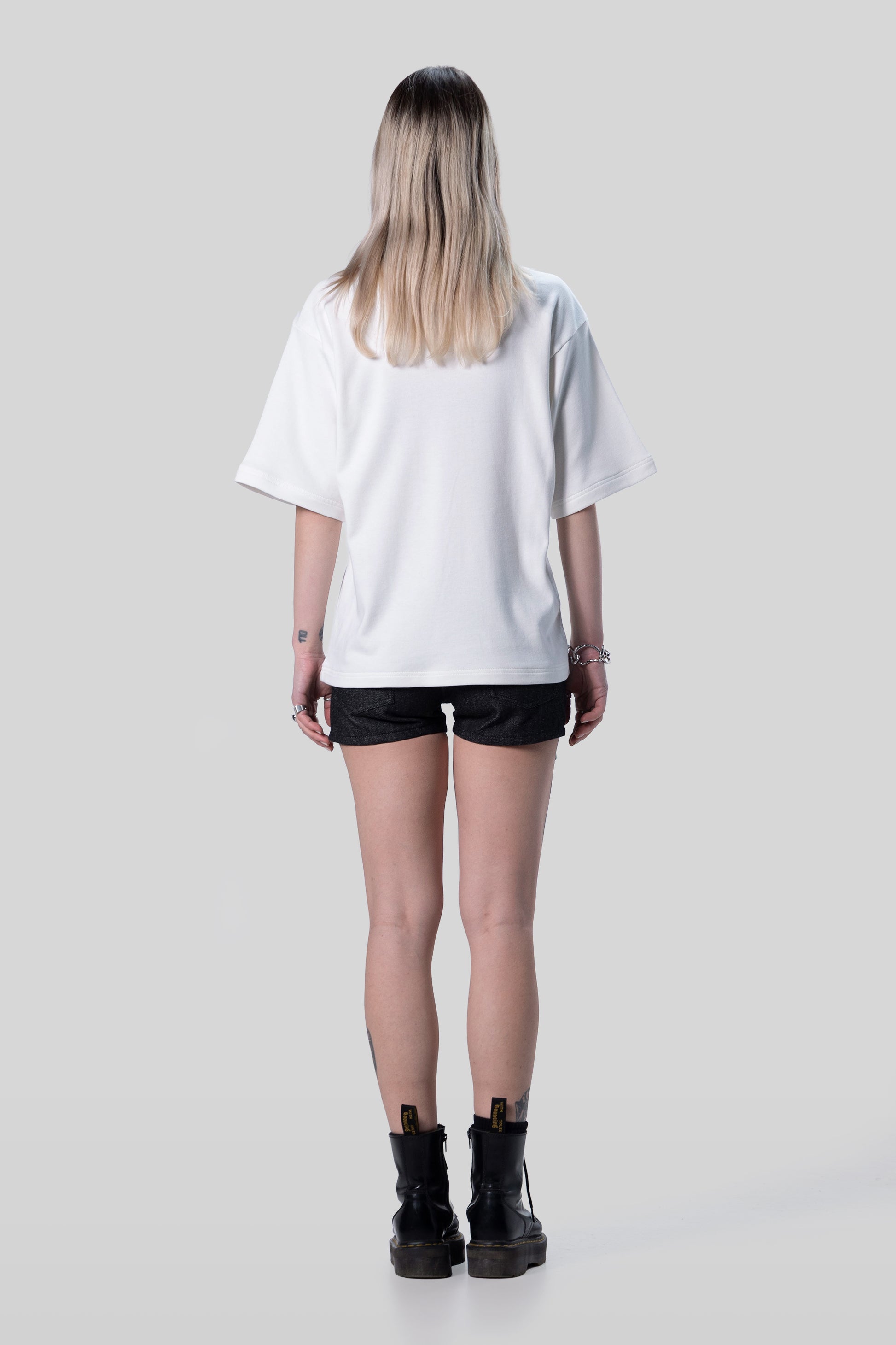 Back view of white Supima cotton Women’s Lineage Tee, clean finish