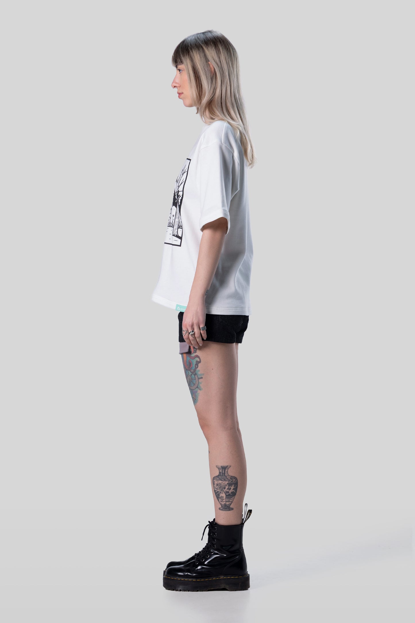 Side profile of white Supima cotton Women’s Lineage Tee, relaxed silhouette
