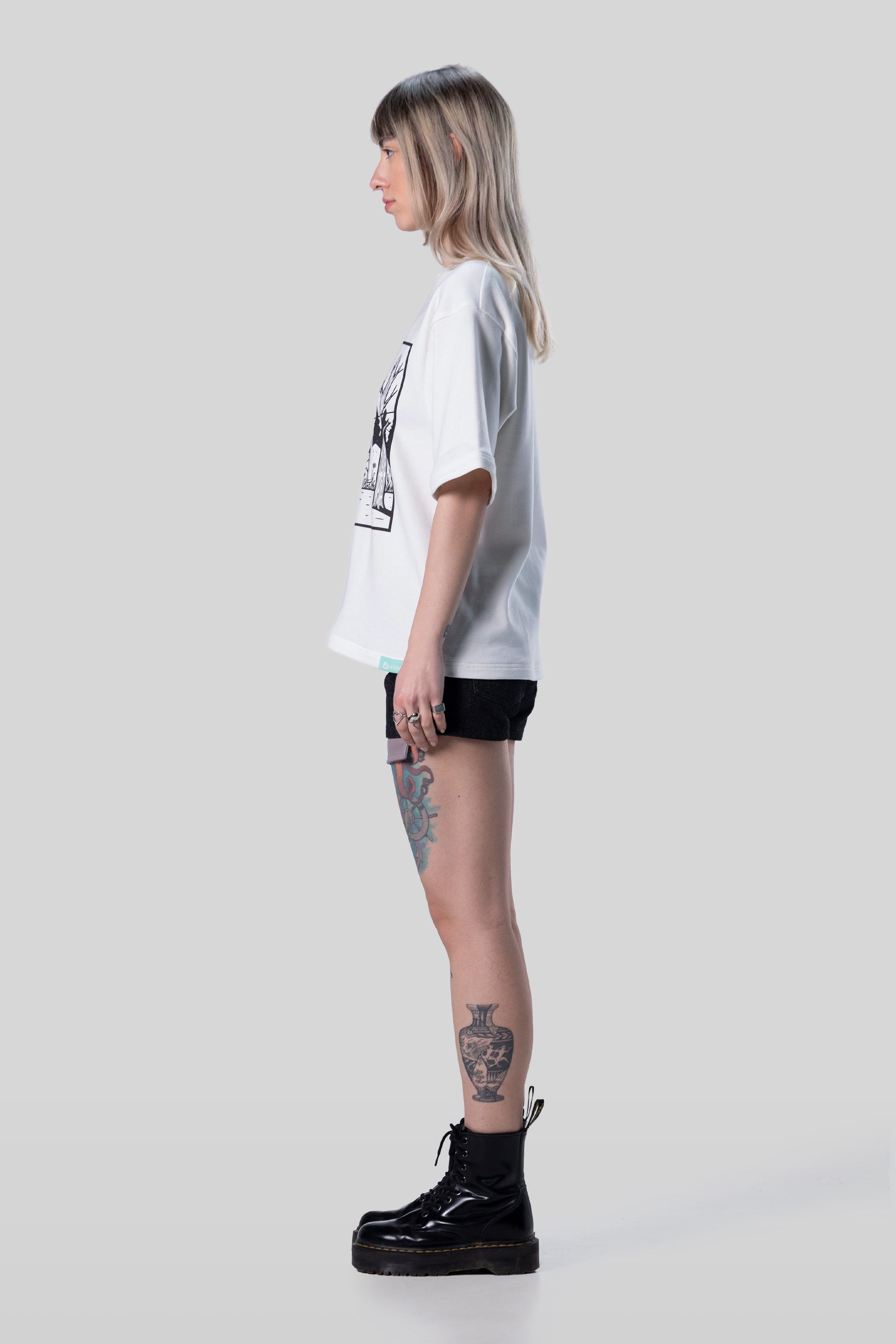 Side profile of white Supima cotton Women’s Lineage Tee, relaxed silhouette
