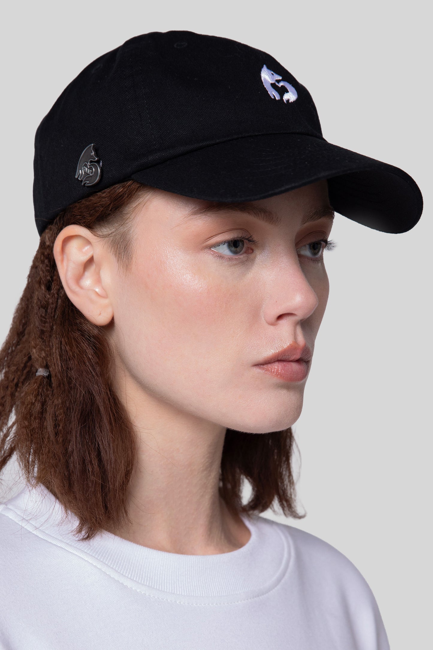 Angled view of black No Cap hat, low profile fit