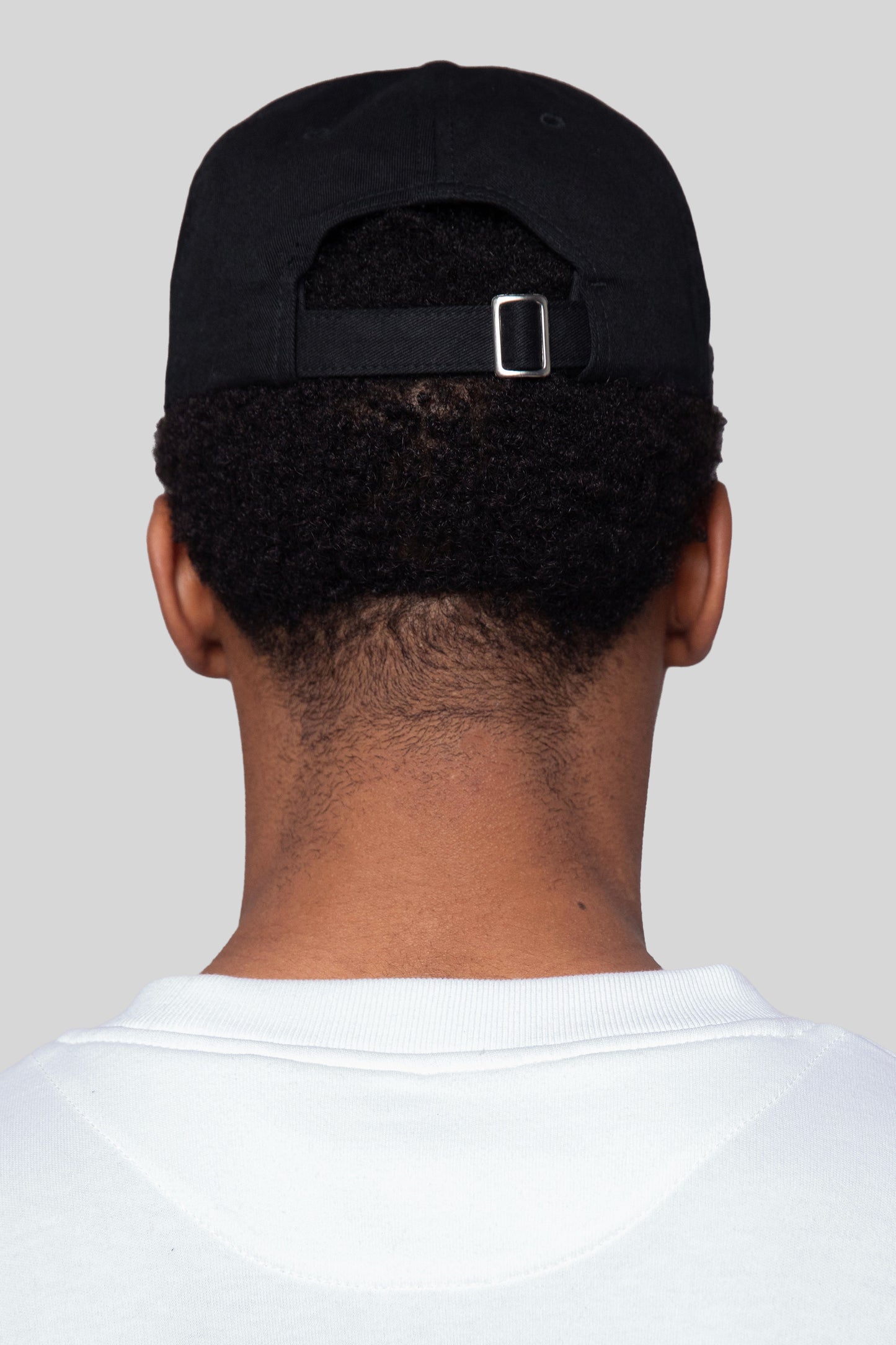 Rear detail of black No Cap hat in eco-wash cotton