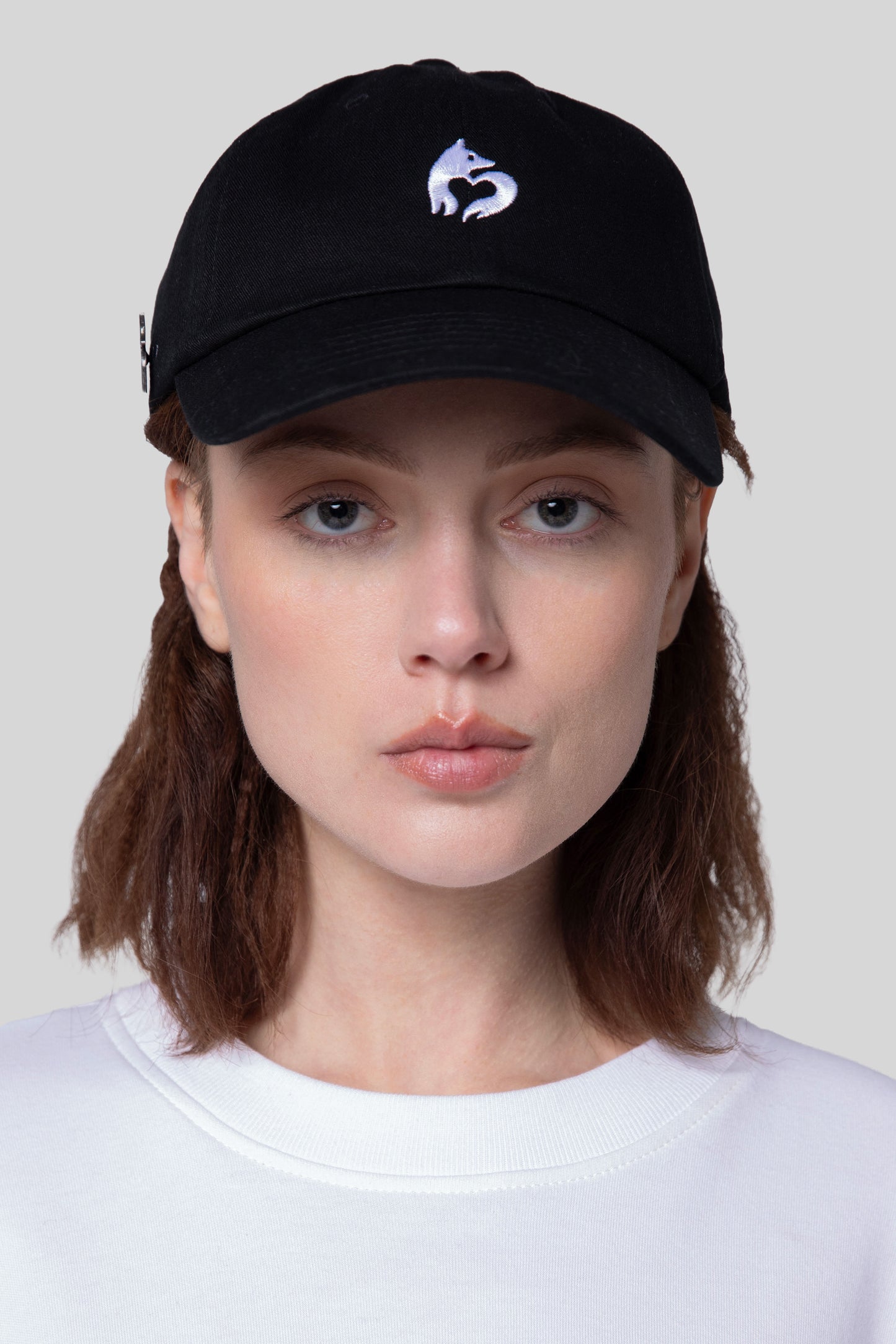 [card:women-secondary] Front view of black No Cap hat with low profile crown on model