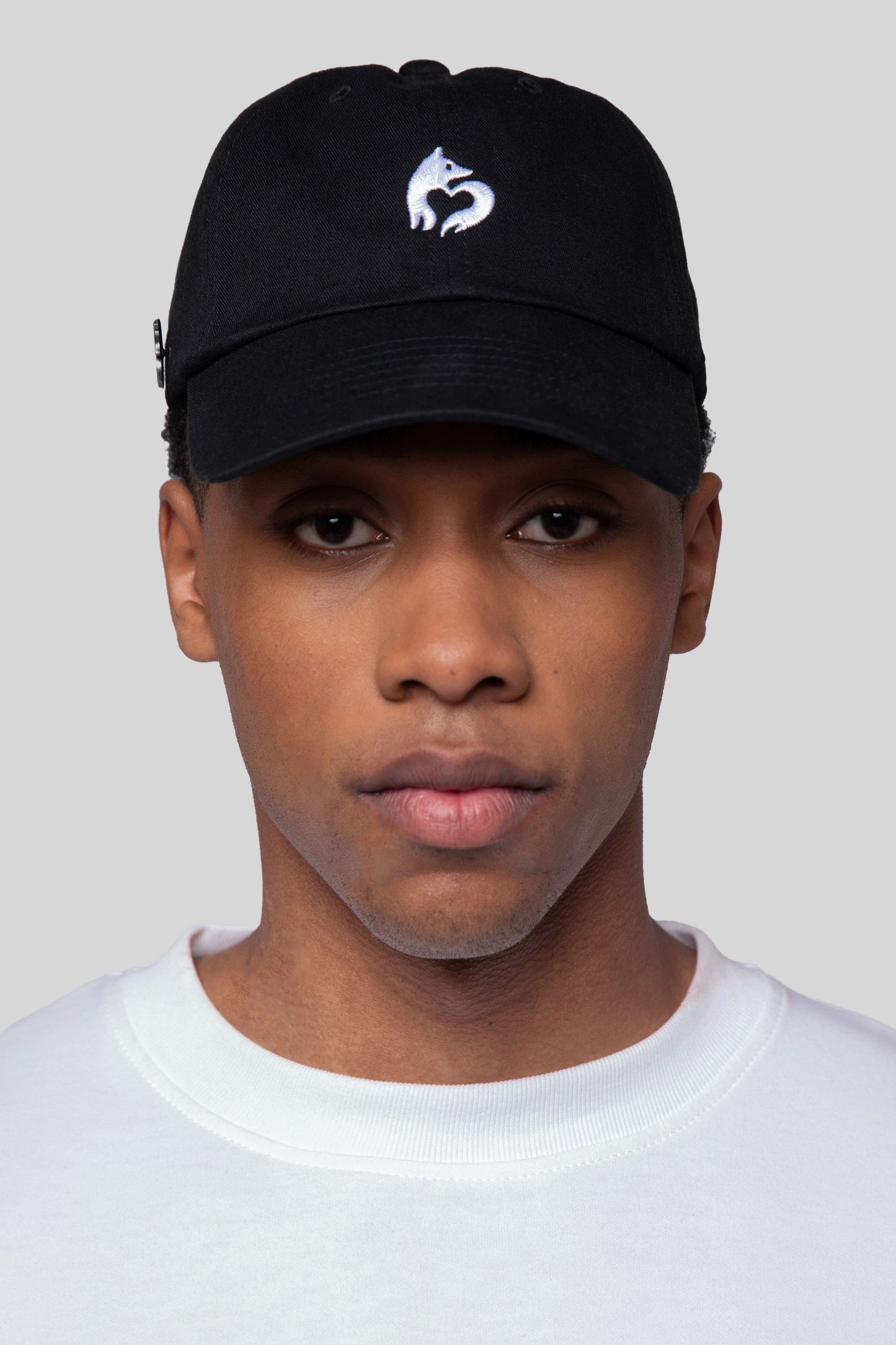 Front view of black No Cap hat in eco-wash cotton on model