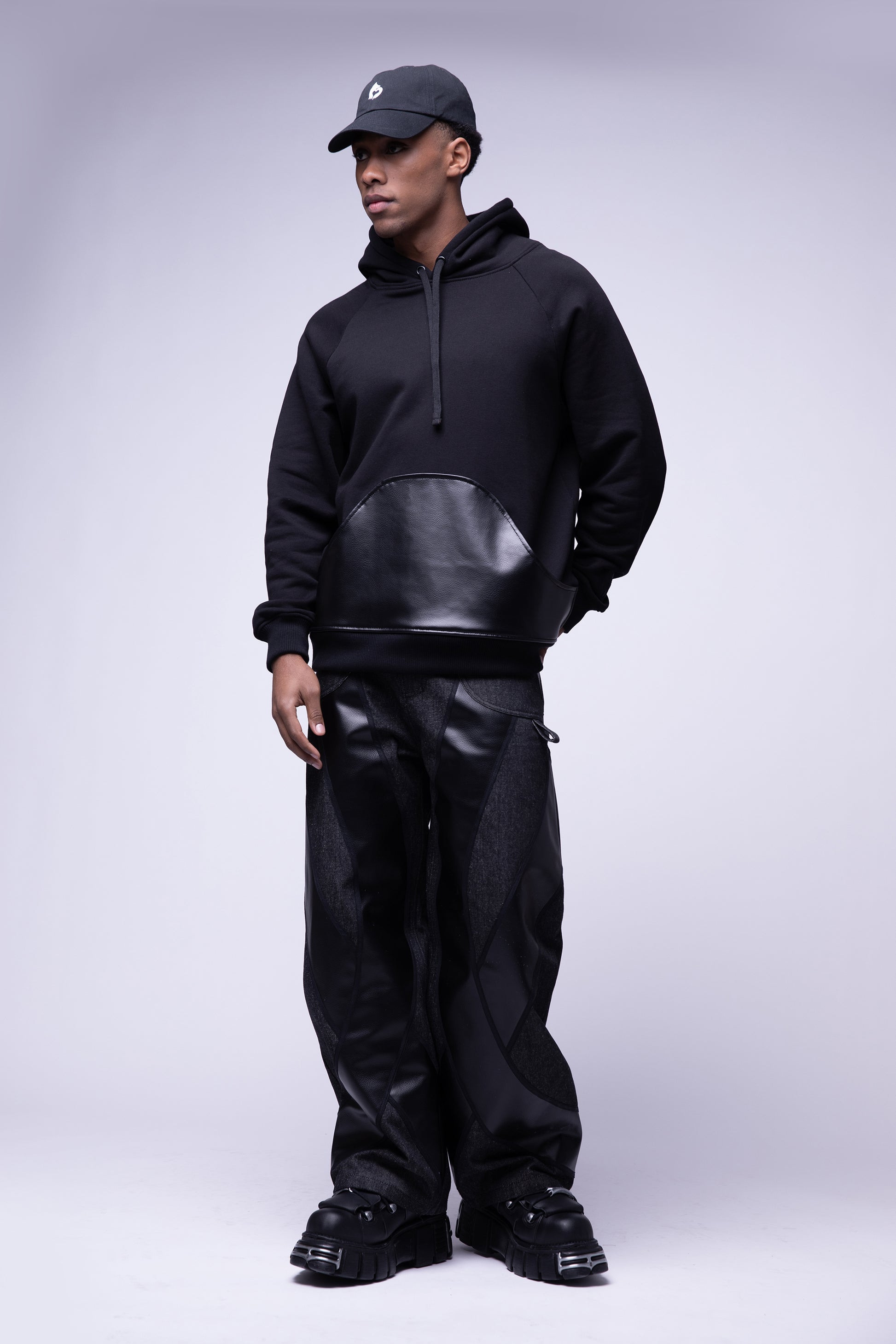 Full body view of model wearing black No Cap hat with low profile silhouette, with Shadow Hoodie and Bloom Jean