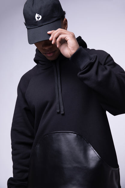 [card:men] Model wearing black No Cap hat in eco-wash cotton, low profile fit, paired with Shadow Hoodie