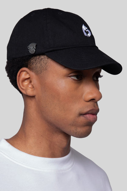 Side profile of black No Cap hat in eco-wash cotton