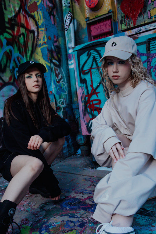 Models wearing 4NML No Cap hat in eco-wash cotton, black and oak colorways, campaign styling